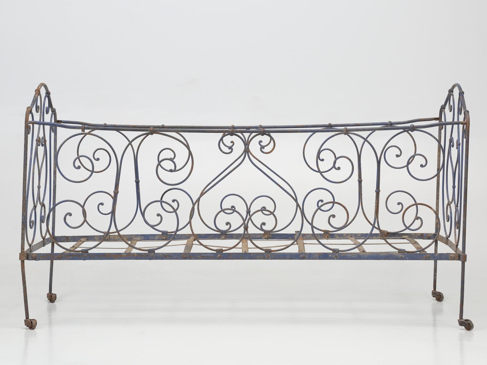 Antique French Child’s Iron Bed in as found condition, with Original Old Paint and could be used to house a Doll or Stuffed Animal collection. Very decorative and very inexpensive.
