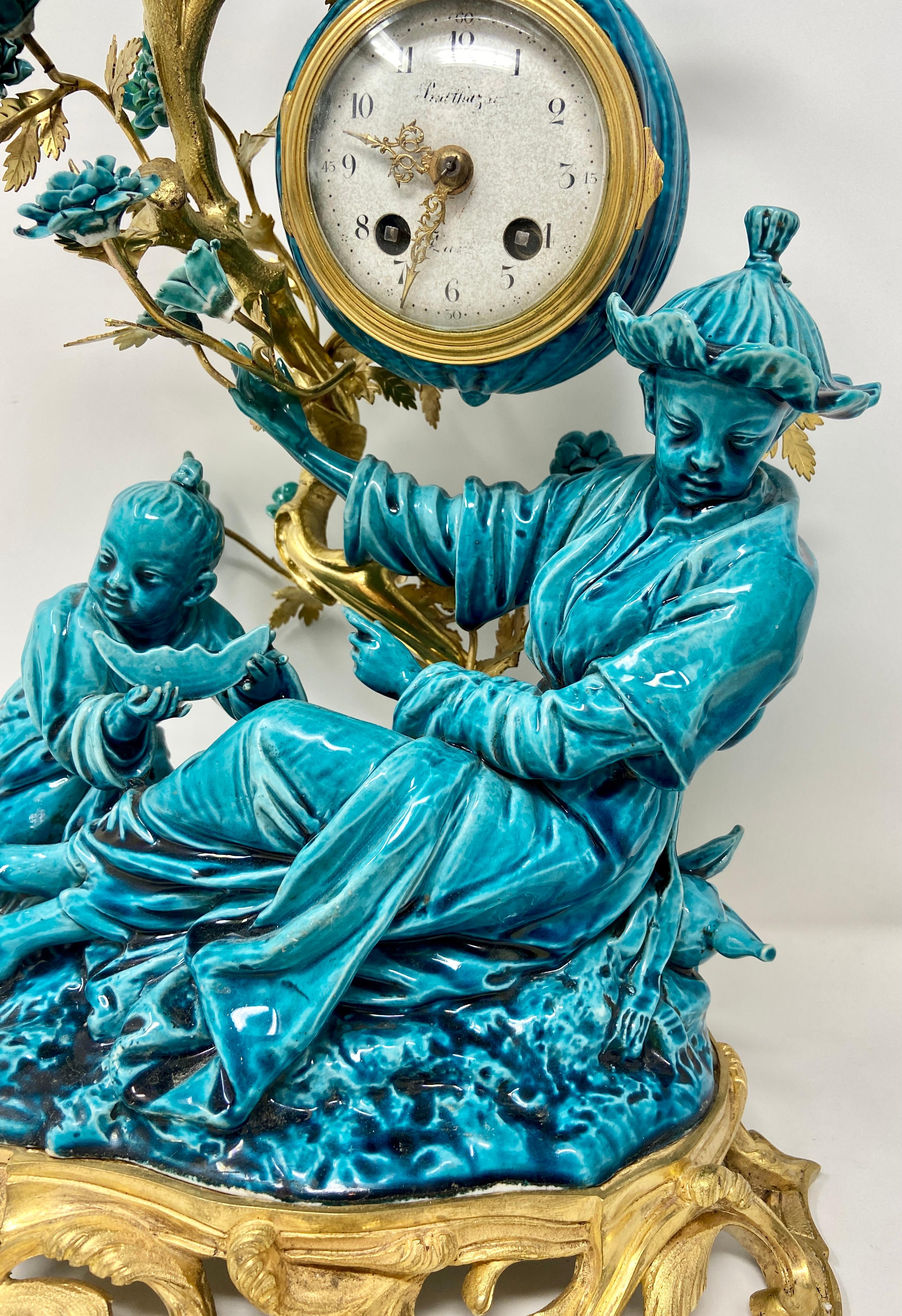 Wonderful Antique French Chinoiserie Style Gold Bronze & Turquoise Glazed Porcelain 3 Piece Garniture Clock Set, Circa 1890's-1900.
Clock: 16 inches in height x 11 inches in width x 9 inches in depth 
Birds: 12 inches in height x 6 inches in width
