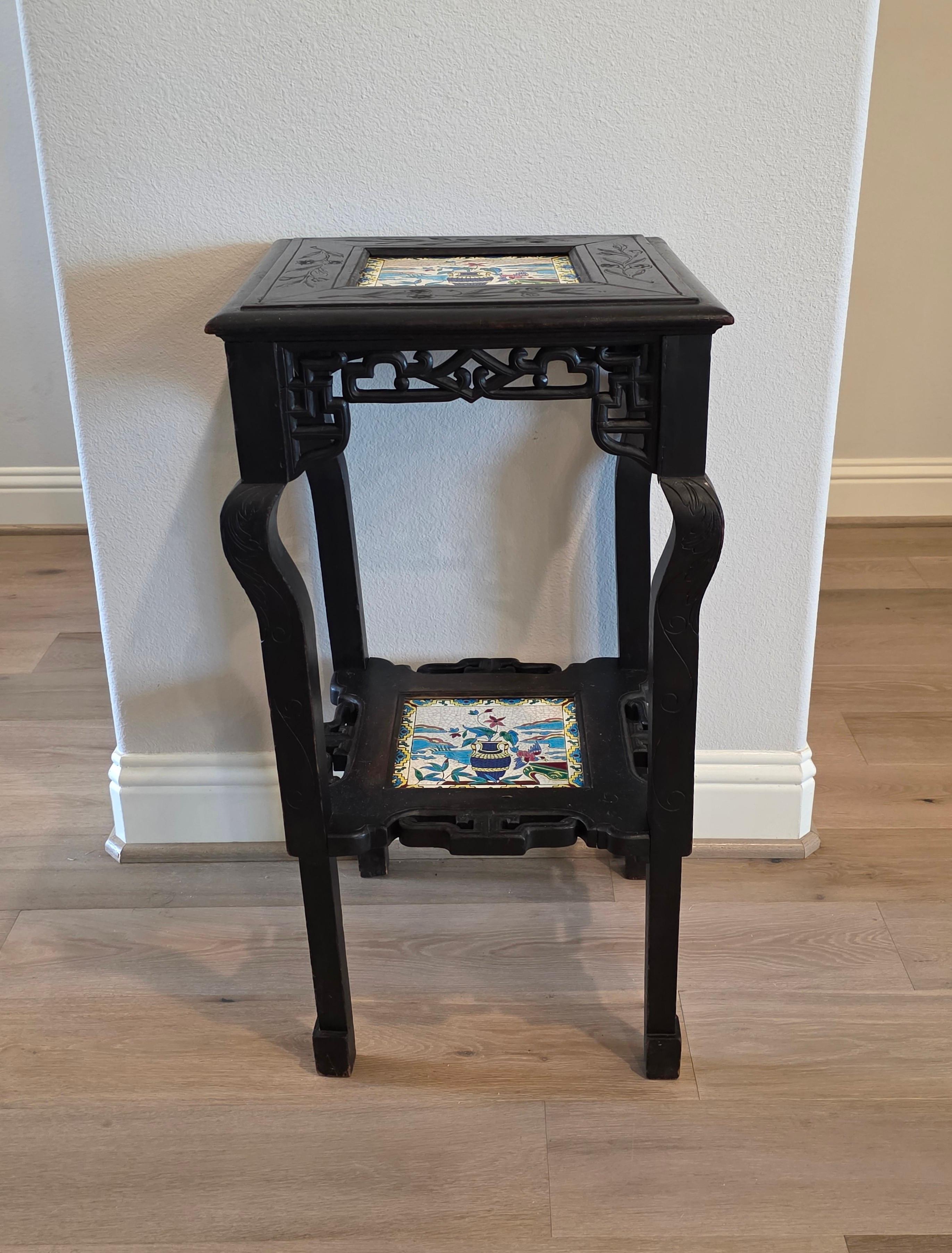 A quite unique and visually appealing French Chinoiserie / Japonisme carved and ebonized hardwood two-tiered side table or stand, with interesting history and highly desirable Longwy pottery tiles! circa 1890

Late 19th century, France, in the