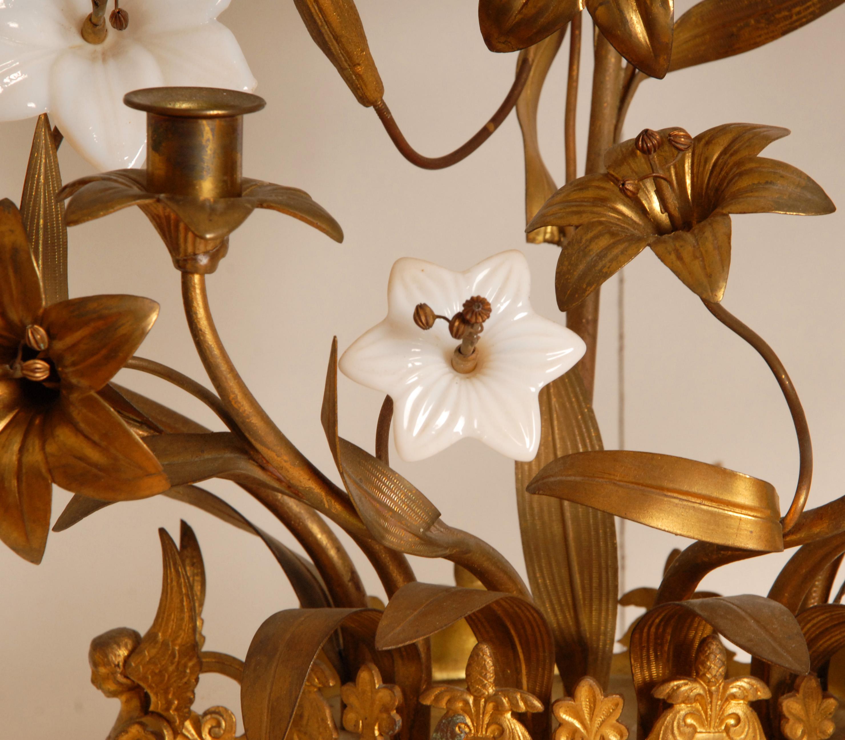 A pair tall French Church candelabra, made of bronze and brass.
Style: Antique, French, French Country, Farmhouse, French Provincial and Mediterranean.
Beautifully and lavishly decorated with gilt brass and white opaline glass flowers.
It stands on