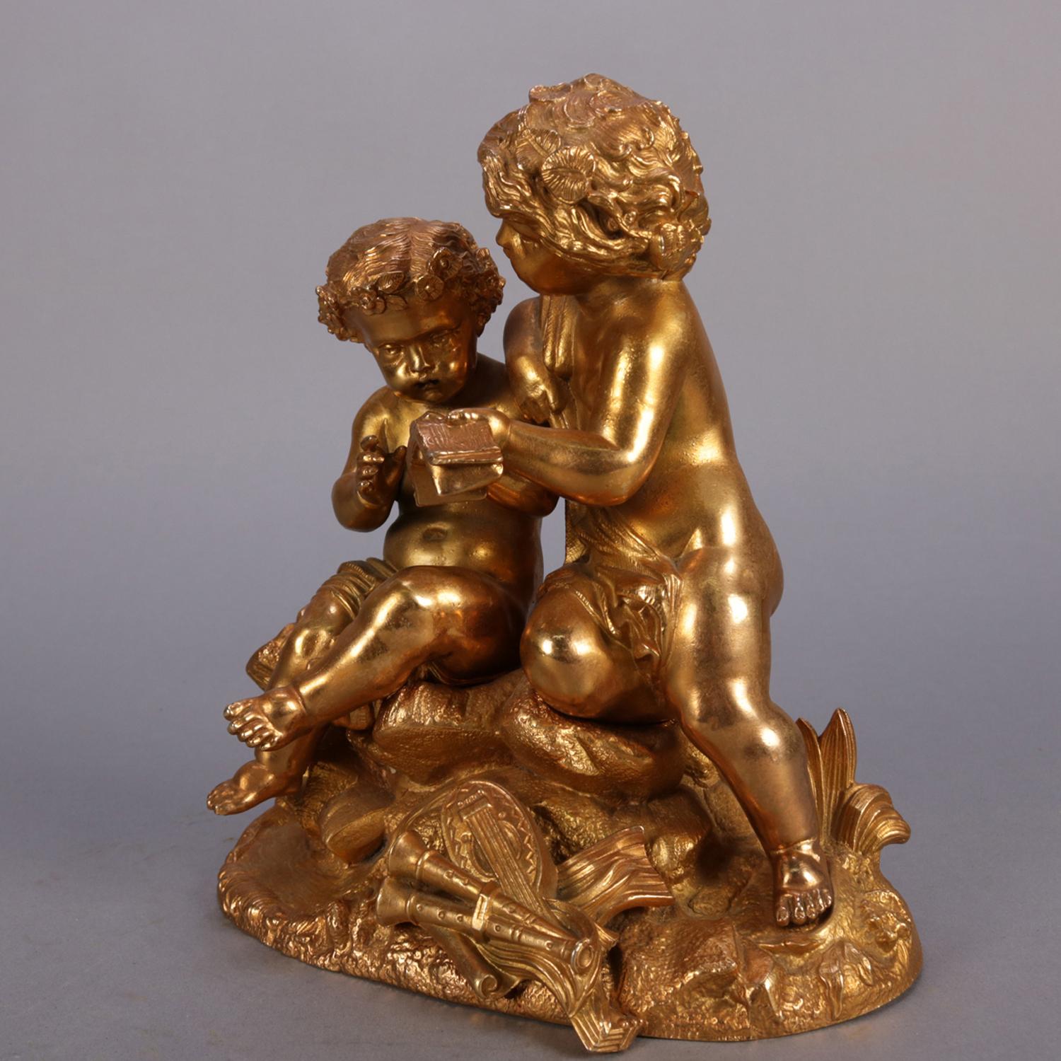 Antique French Classical gilt metal figural sculpture by Philippe Mourey (1840-1910) depicts master and student cherubs seated on tree with musical instruments at foot, stamped on back 