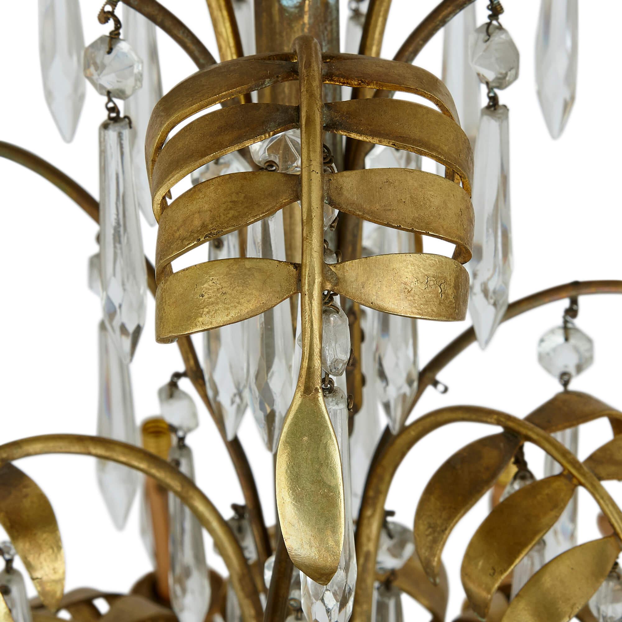 Antique French clear cut glass and ormolu twelve-light chandelier
French, c. 1880 
Height 115cm, diameter 75cm

This eye-catching chandelier was crafted in France in the late 19th century. Its splendid shape and decoration are made from ormolu and