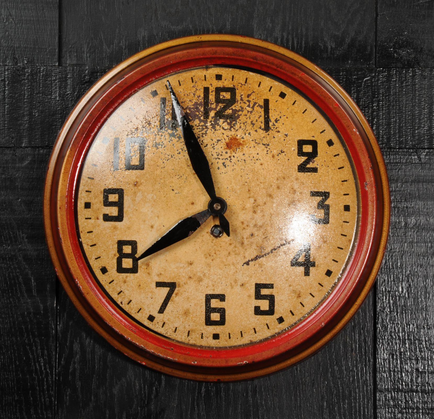A wonderful early 20th century red and gold tole wall clock with a beautiful patination after years of neglect. The dark and light gold original finish has a wonderful craqueler and is speckled with rust. Originally a mechanical movement by the