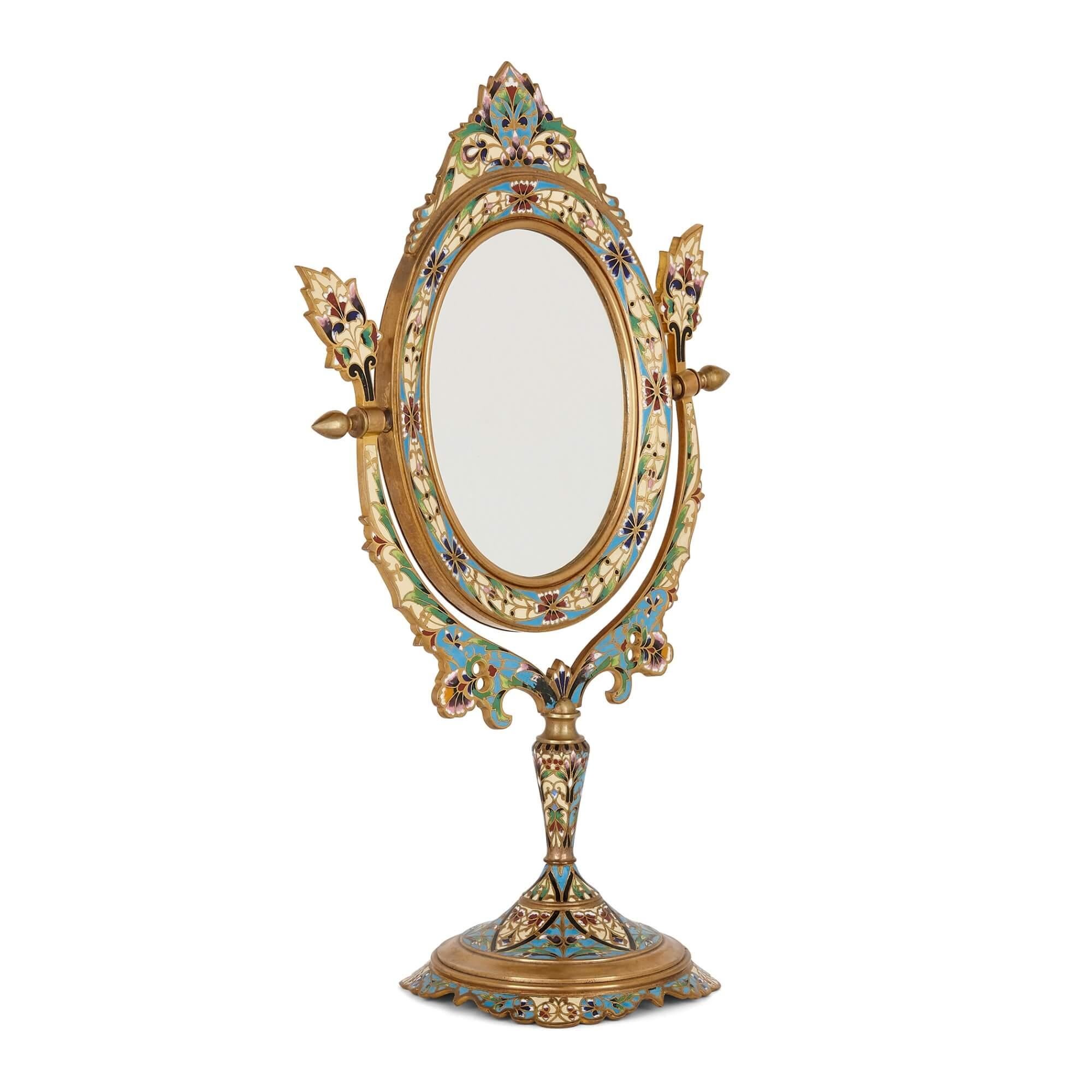 Antique French cloisonné enamel and gilt metal table mirror
French, late 19th century
Height 39cm, width 23cm, depth 12cm

This exquisitely detailed table mirror is intricately decorated all over with cloisonné enamel. The mirror is of oval
