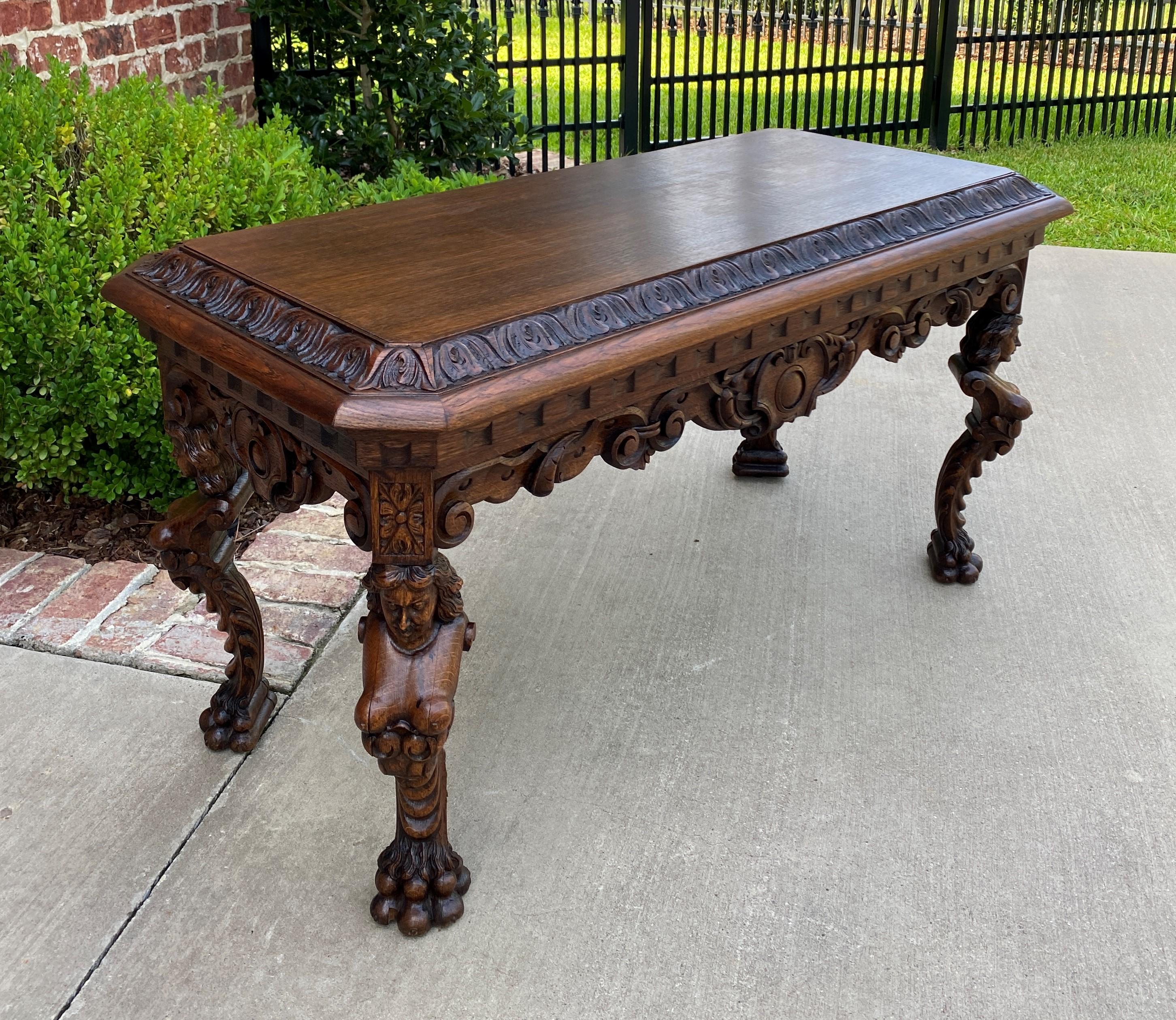 RARE Antique French Carved Oak Renaissance Revival coffee table or bench~~c.1900- 1920s

Beautifully carved and impossible to find~~scrolled figural supports with hairy paw feet~~wonderful apron or skirt with French flourish~~raised beveled edge