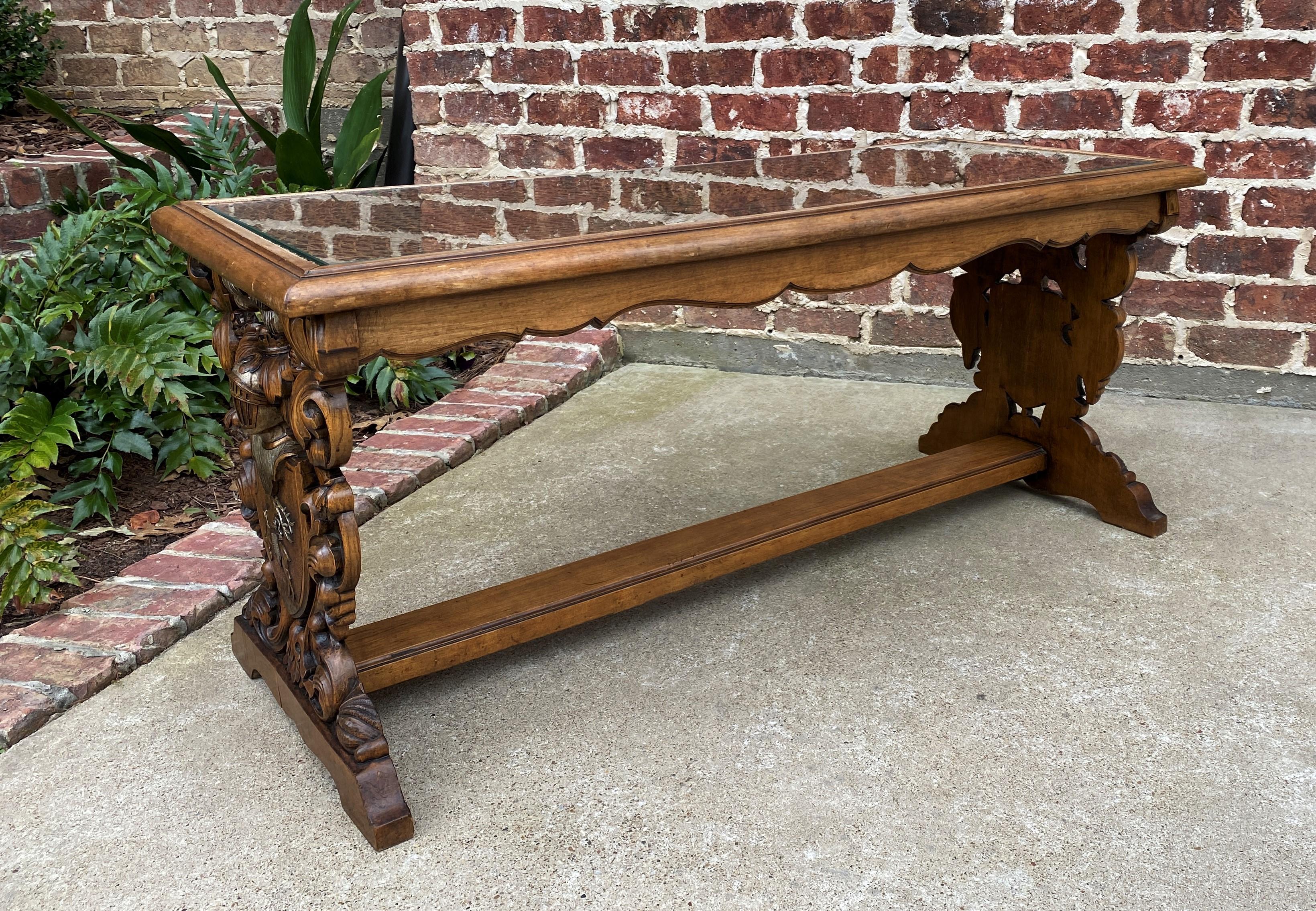 Unique antique carved oak French Renaissance Revival coffee table with cane top and glass inset~~c. 1920s

 Nicely carved knight with shield on sides~~French 