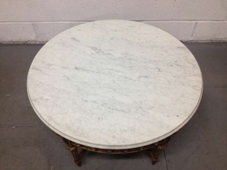 Late 19th century, French, Carrara marble top coffee table with a total of 36 porcelain Sèvres plaques. The table has bronze mounts.
  