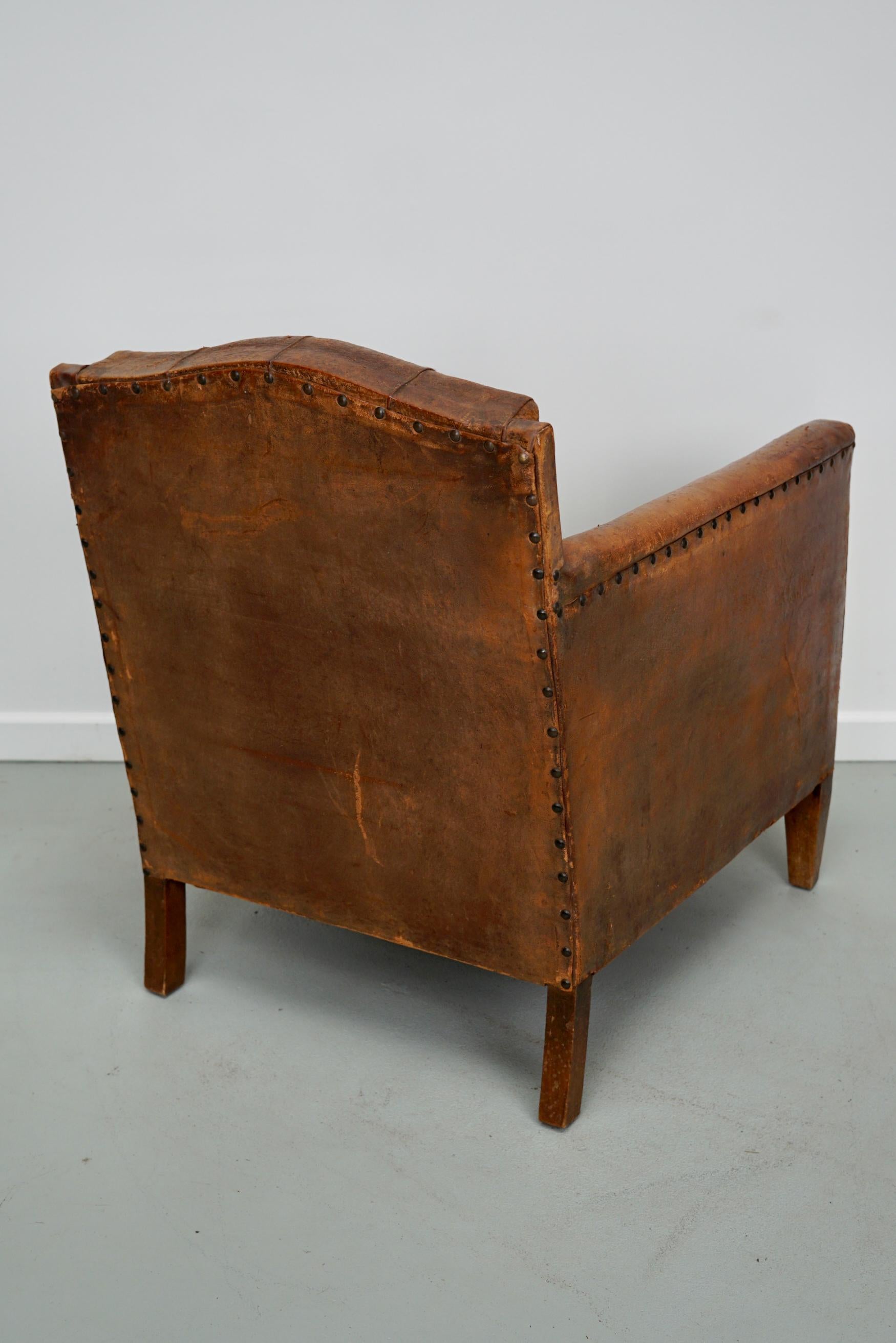 20th Century Antique French Cognac Leather Buttoned Back Club Chair For Sale