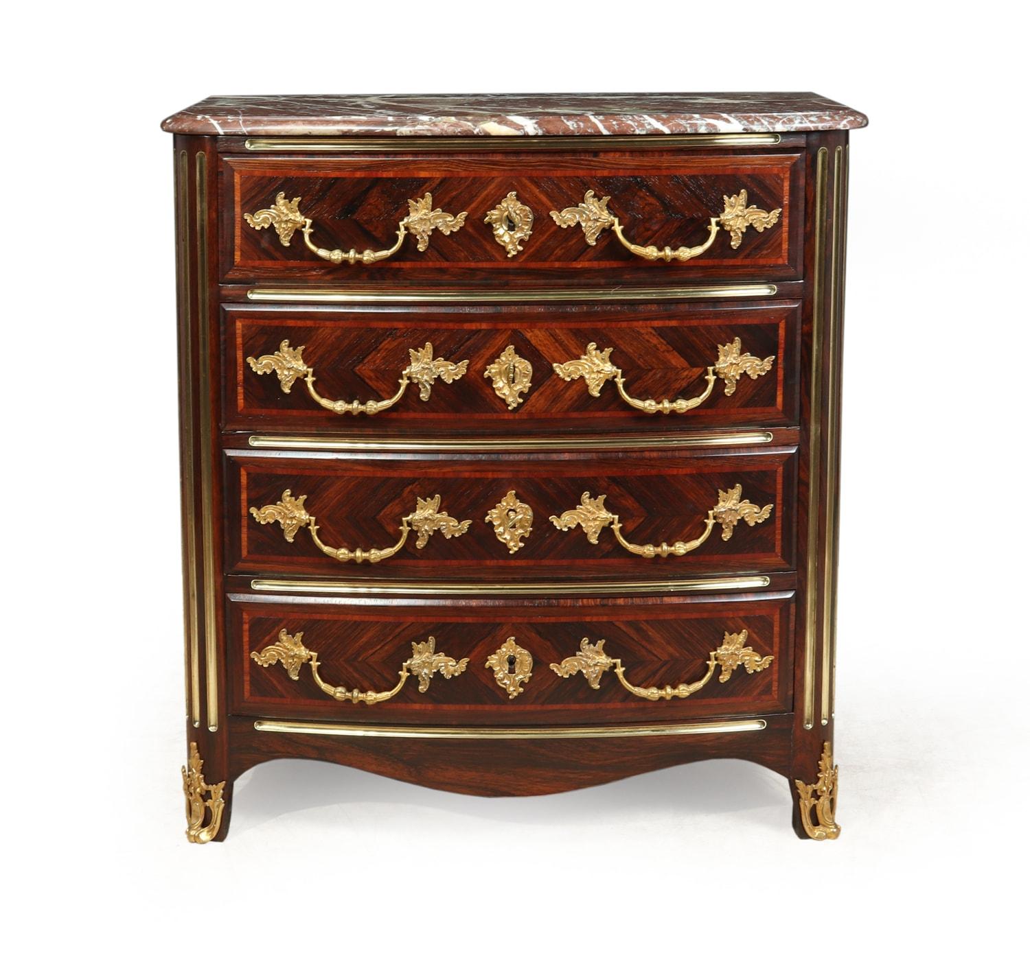 Antique French commode chest of drawers circa 1880

A small antique bow shaped front chest of four long drawers with shaped rouge breccia marble,
gilt bronze gilt ormolu feet, Handles and escutcheons , brass inlay corners and drawer slides, it