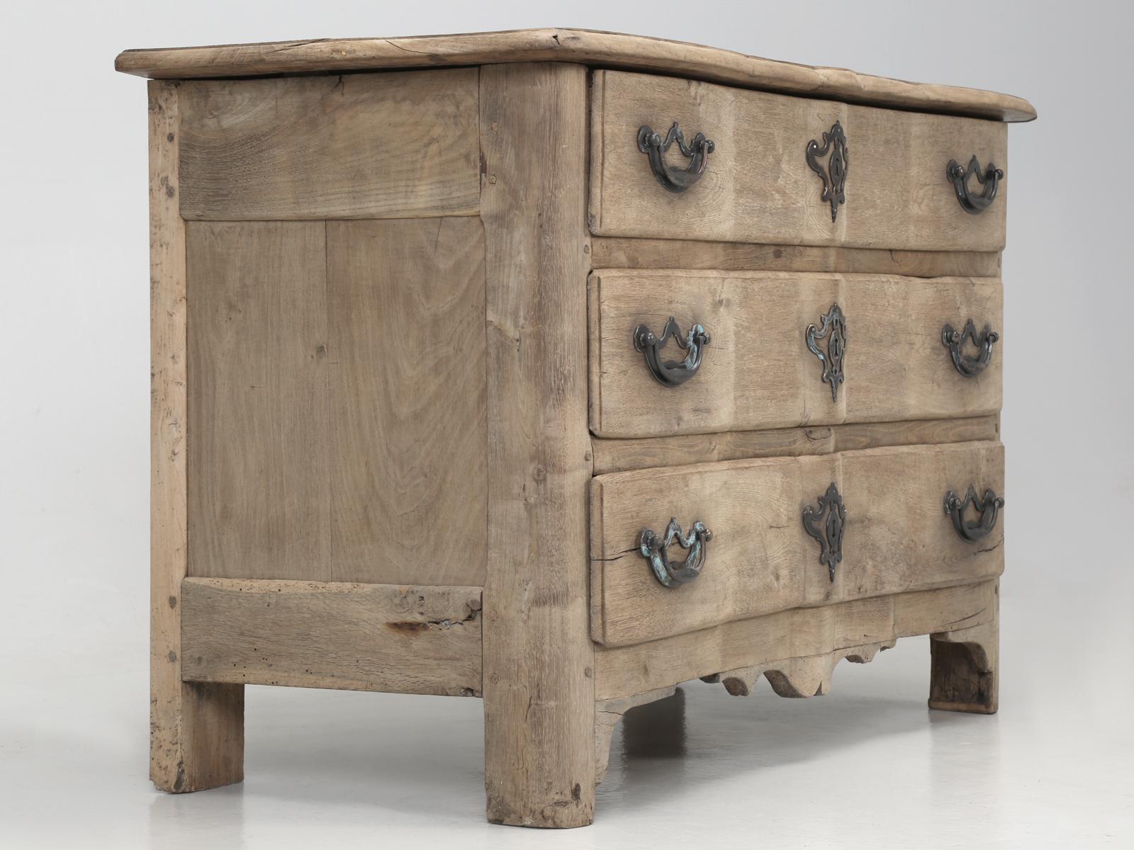 Antique French white oak dresser, chest of drawers or commode. Beautifully shaped with a serpentine front and a terrific, shall we say, lack of any finish? This particular antique French commode, appears to have been stripped of any finish a long