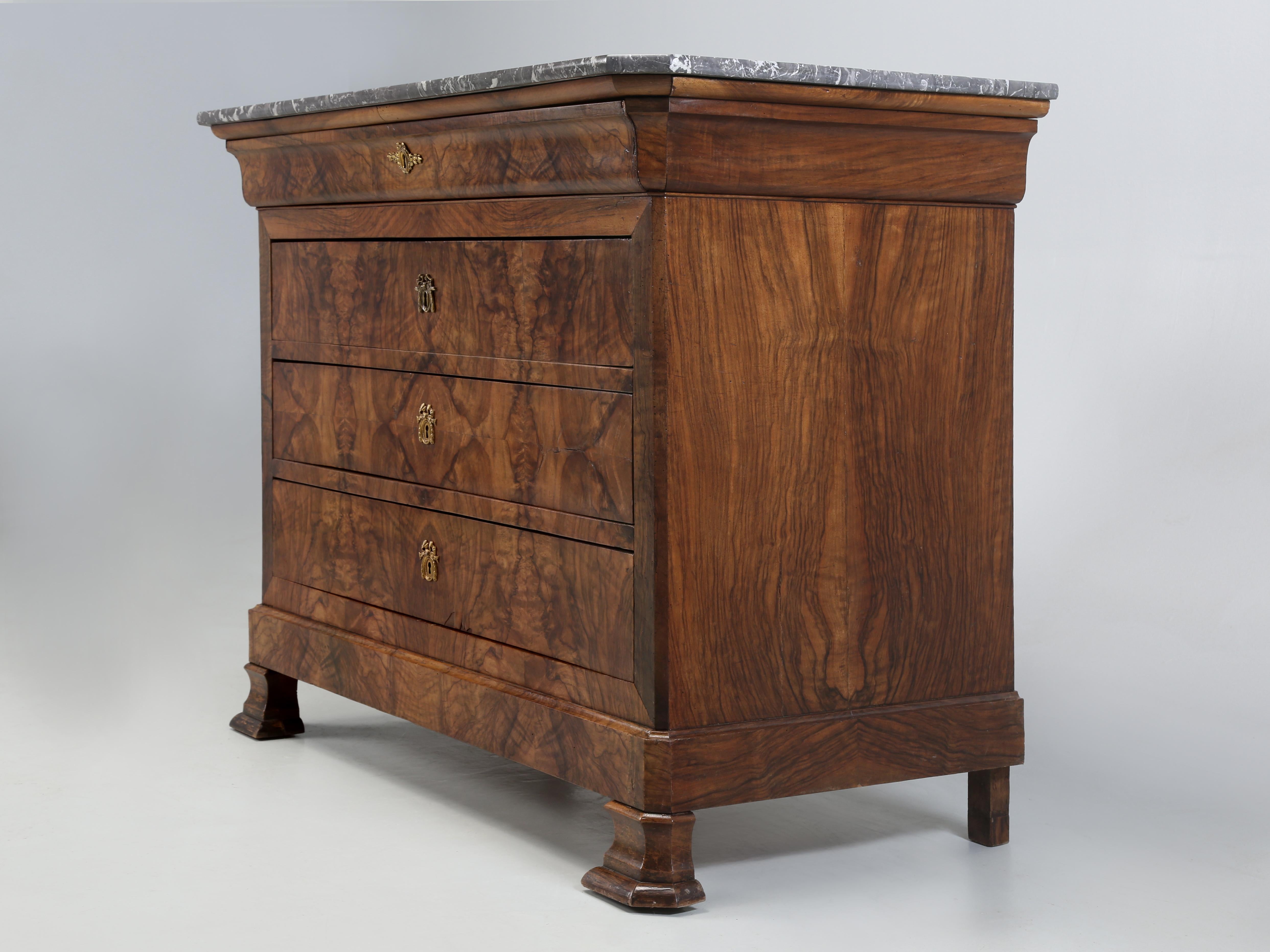 Antique French Commode, Dresser or Chest of Drawers in the Louis Philippe style. Our Antique French Commode was made with Burl-Walnut that has been carefully Book-Matched with a beautiful marble top. The style of furniture under King Louis Philippe