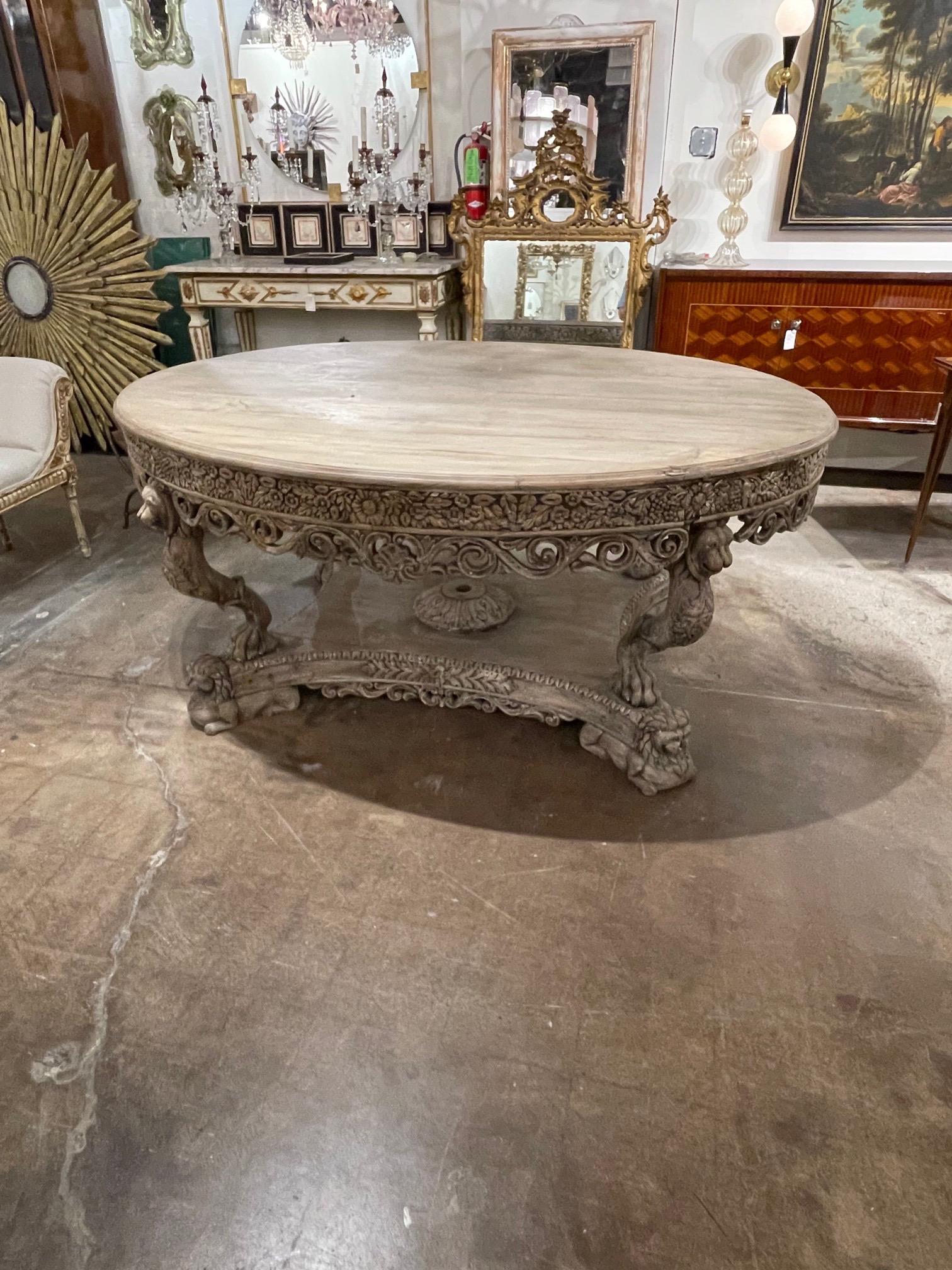 Exquisite antique French Continental carved oak foyer table. The piece has a beautiful bleached finish and exceptional intricate carvings. Stunning!
