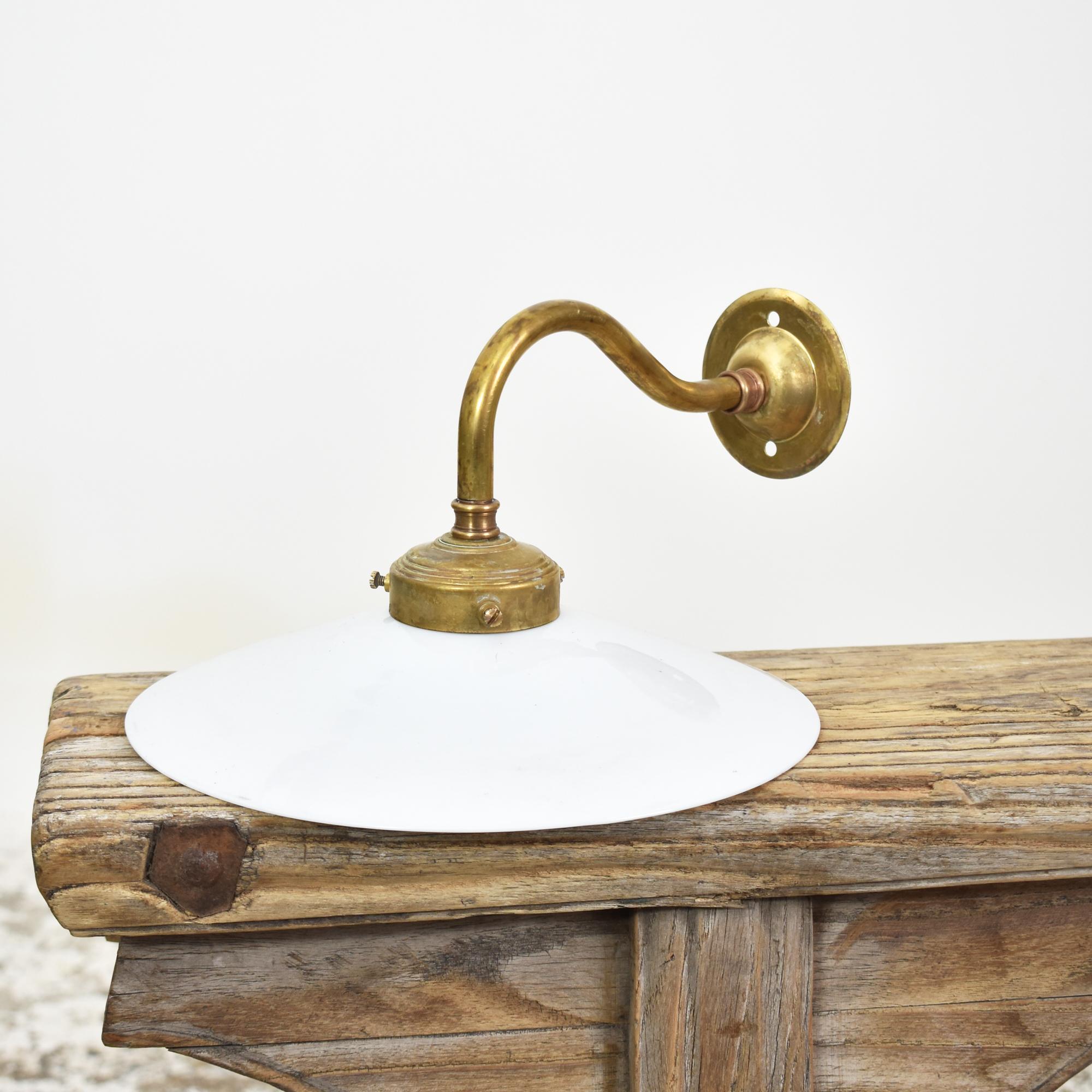 Antique French Coolie Glass Wall Light – H

An early French glass coolie light. The conical milk glass shade has been hand spun from opaque glass. The light has an aged brass gallery and swan neck wall fitting. Great as a task light in the kitchen