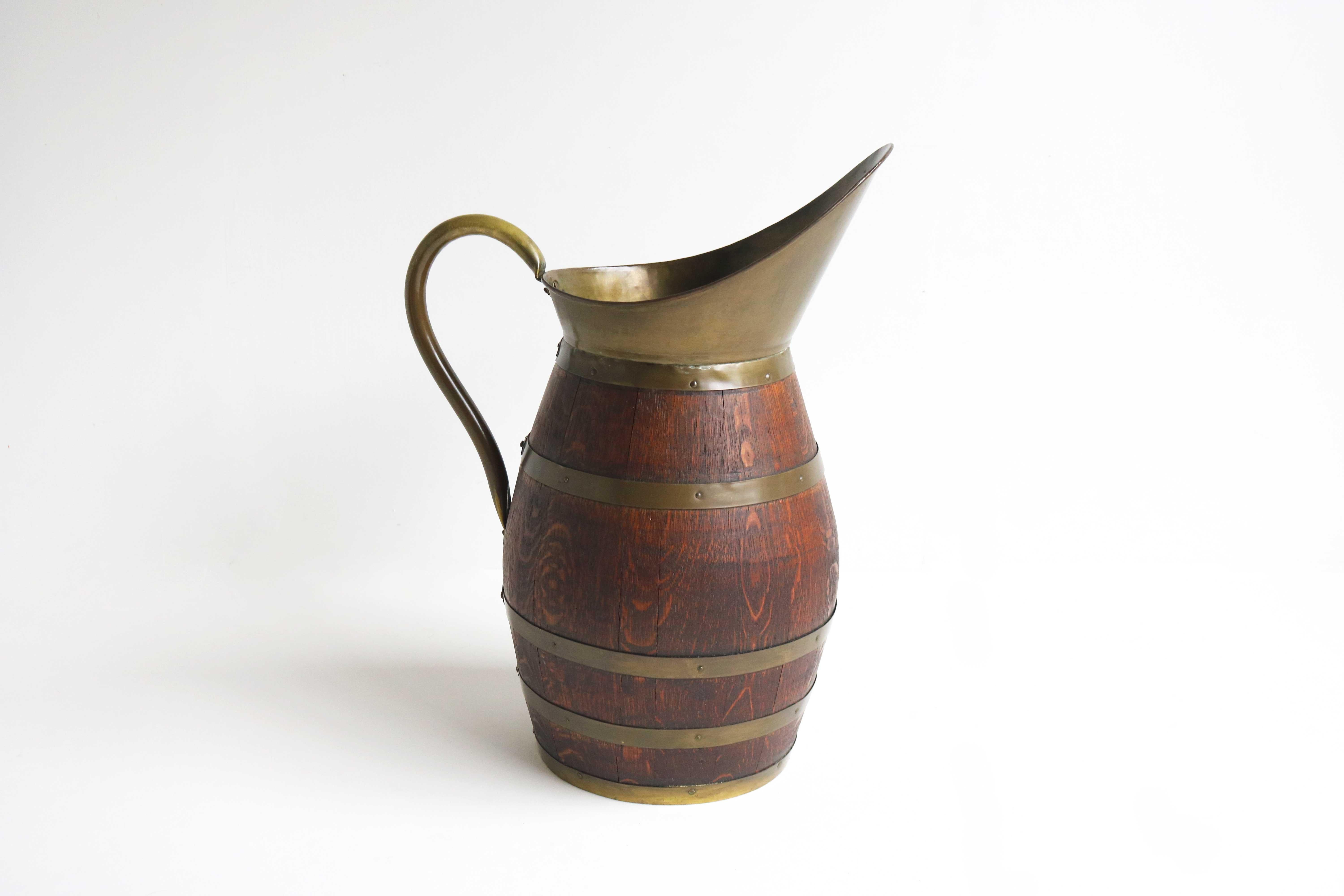 Antique French Copper and Oak Pitcher, Wine Jug Umbrella Holder 1900

Beautiful 19th century rustic French oak and copper banded handmade cider pitcher , from Normandy
Accessorize your wine cellar , kitchen , dining room or entryway with this