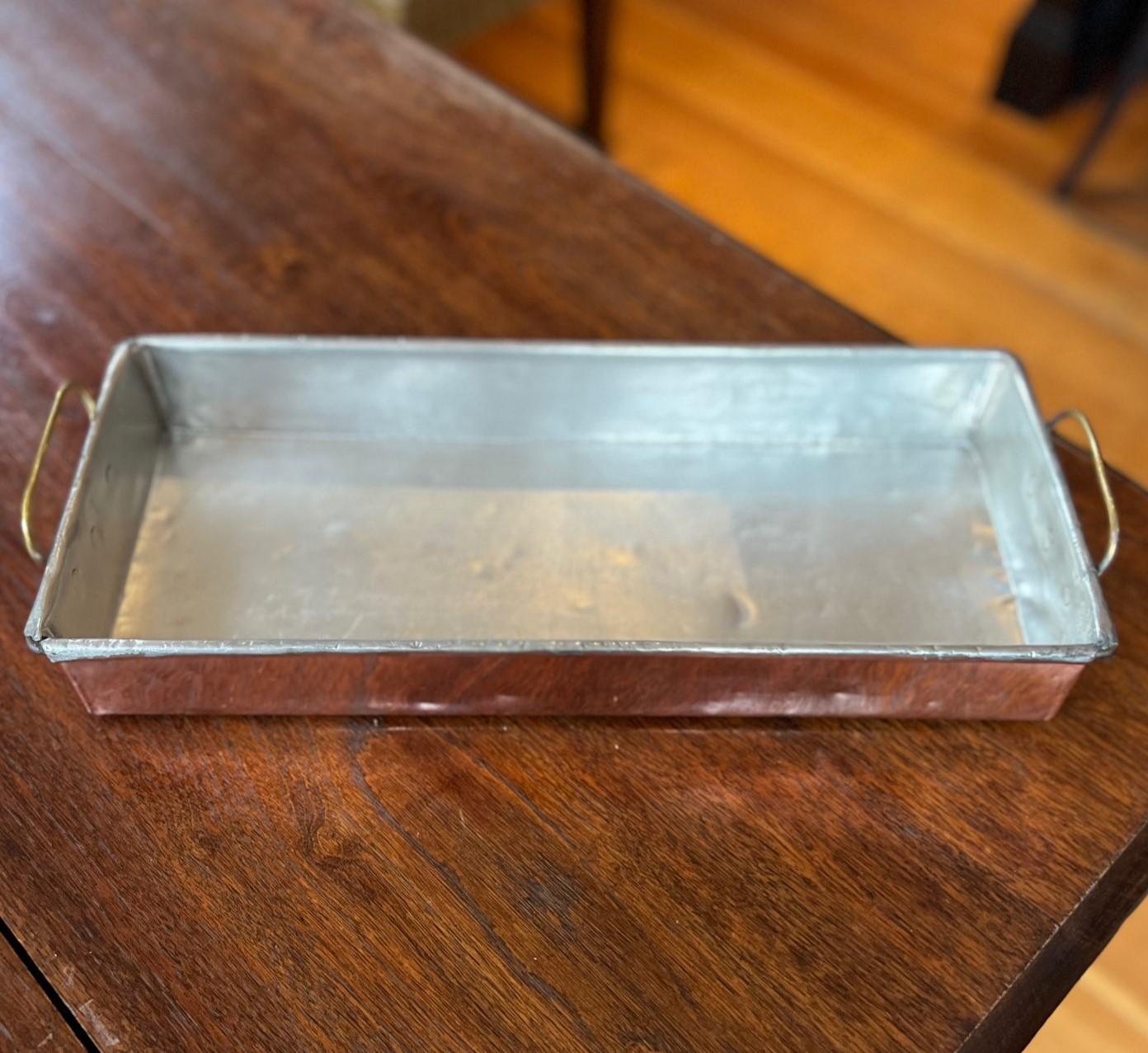 Antique French bain-marie or water bath pan, commonly used for gentle, even cooking of delicate foods like custards, terrines, or pâtés. Crafted from copper with a tin lining, it ensures excellent heat distribution, allowing for precise temperature