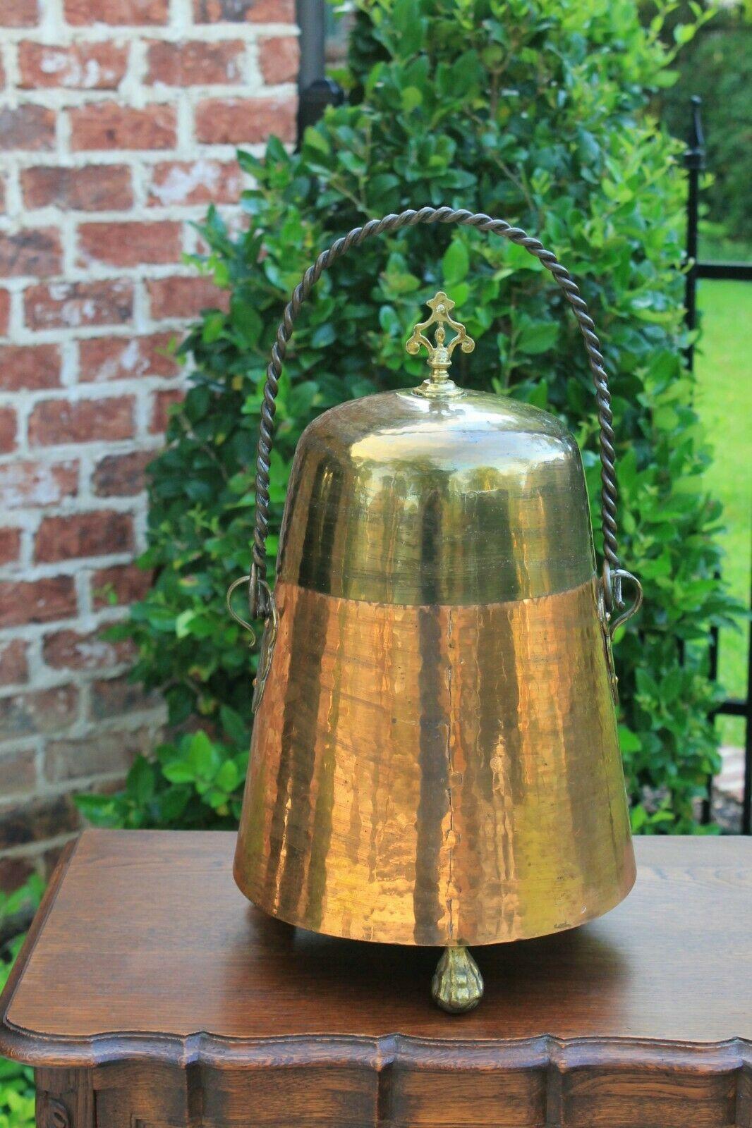 Beautiful and unique French copper vessel jug with brass lid and rope handle~~19th Century 
Excellent hand-seamed copper vessel with removable brass lid~~heavy braided handle with 