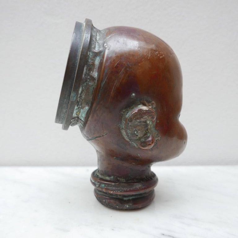 Rare antique doll mould. 

Naturally patinated copper. 

Used to create doll heads. 

Now an unusual shelf or desk curio. 

circa 1920s, French.
 