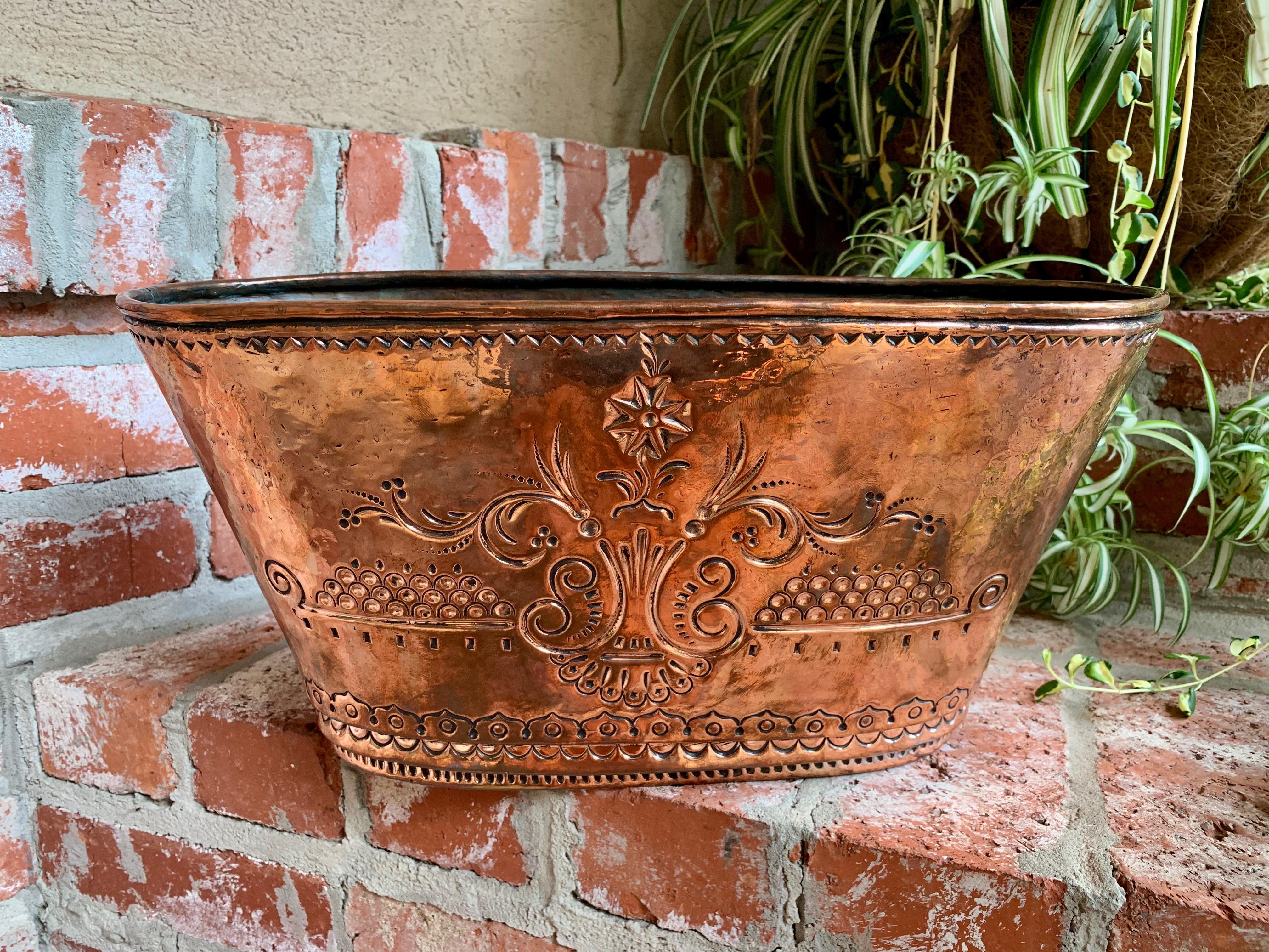 Antique French copper embossed planter jardinière cachepot oval wine bucket

~Direct from France~ 
~Beautiful antique French hammered copper Jardinière/planter, versatile for many uses, from kitchen décor, to planter, to champagne/wine bucket!~