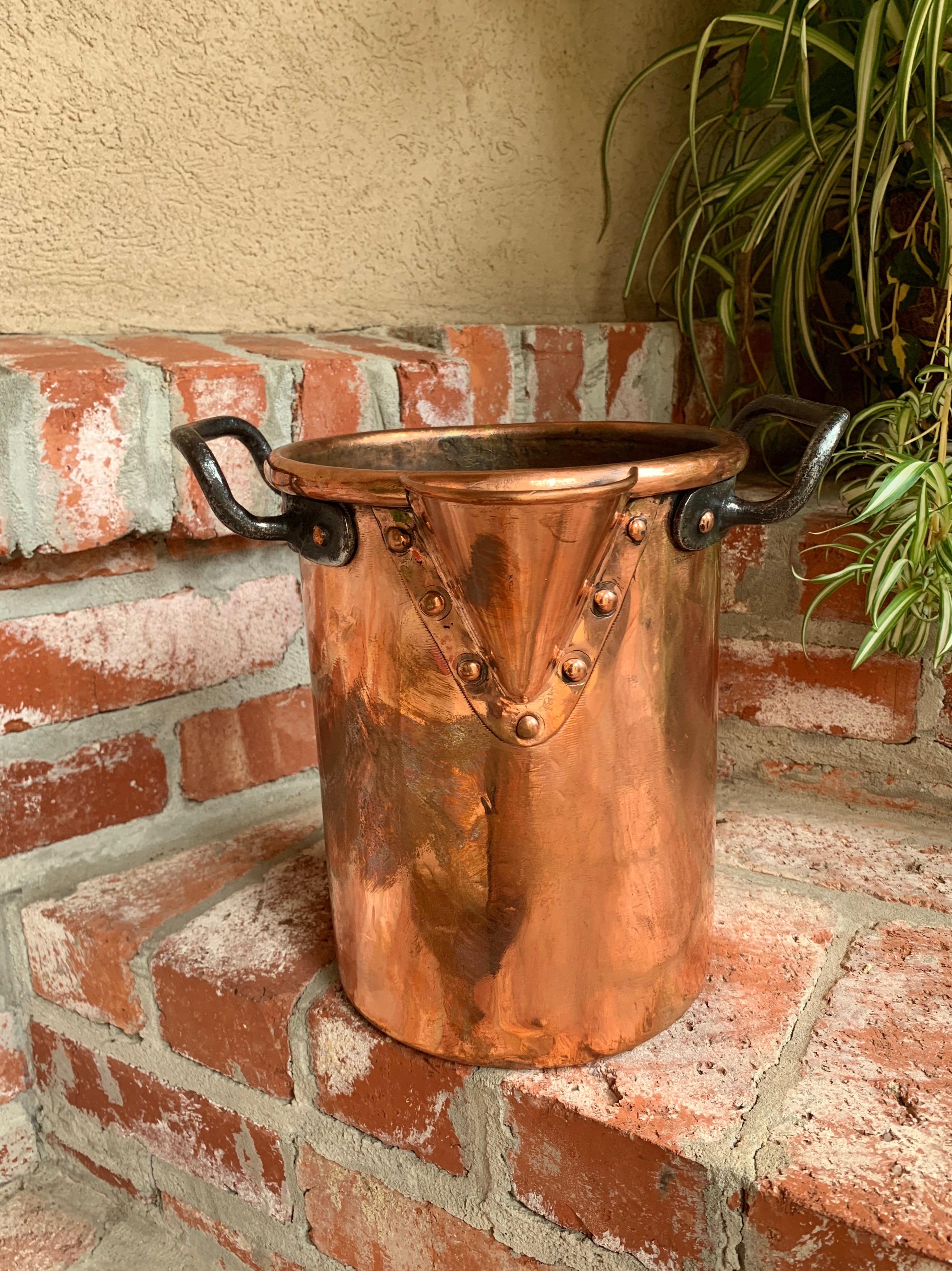 Antique French copper vessel pot Riveted wine champagne bucket 19th century
 
~Direct from France~
~Beautiful antique French copper vessel with spout and handles, and perfect for a wine/champagne bucket!~
~Tall cylinder with large shaped copper