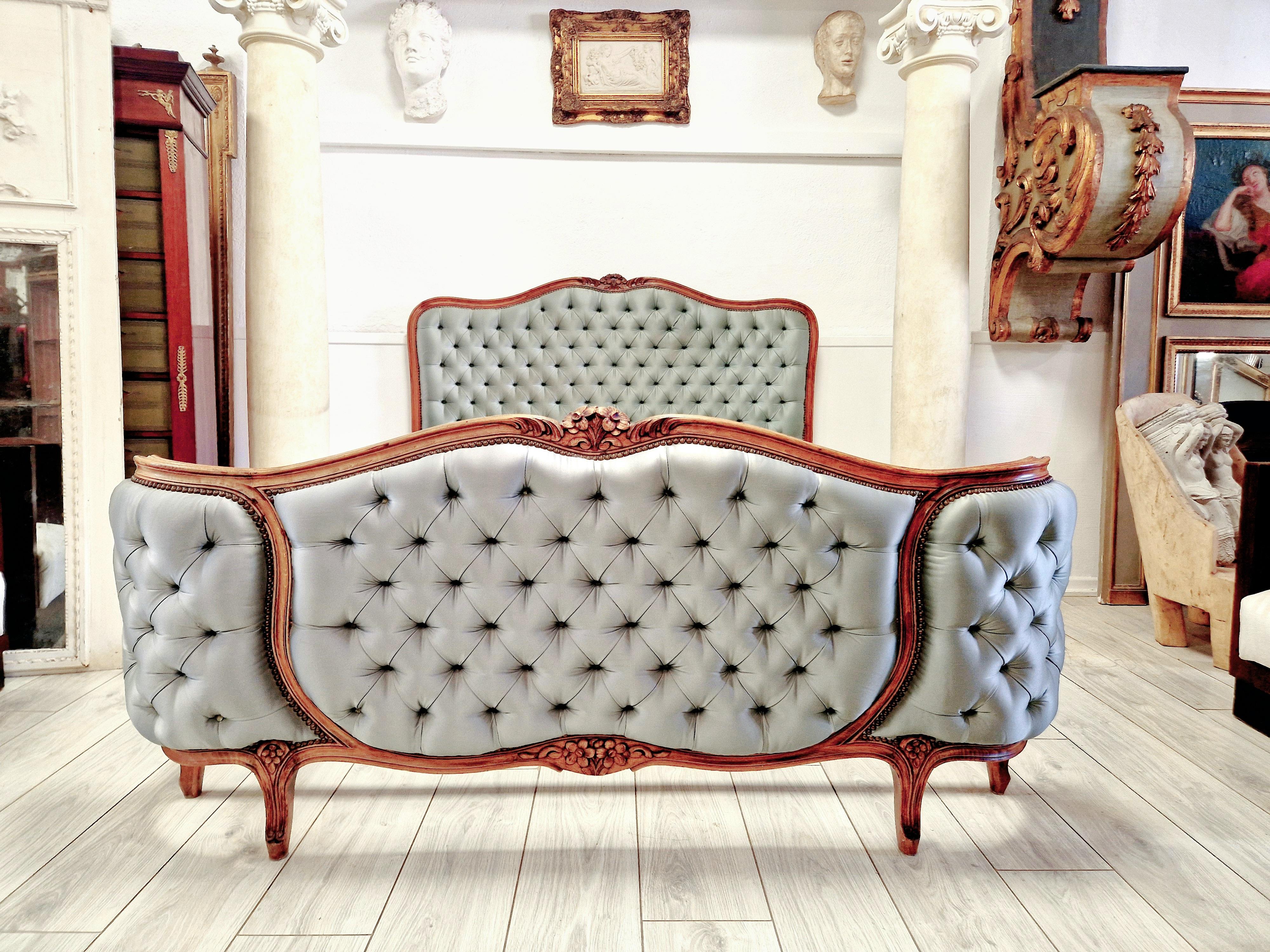Introducing a stunning French corbeille bed, perfect for adding a touch of antique charm to your bedroom. This beautiful bed features a curved shape footboard and is crafted from walnut material, ensuring both durability and style. The bed comes