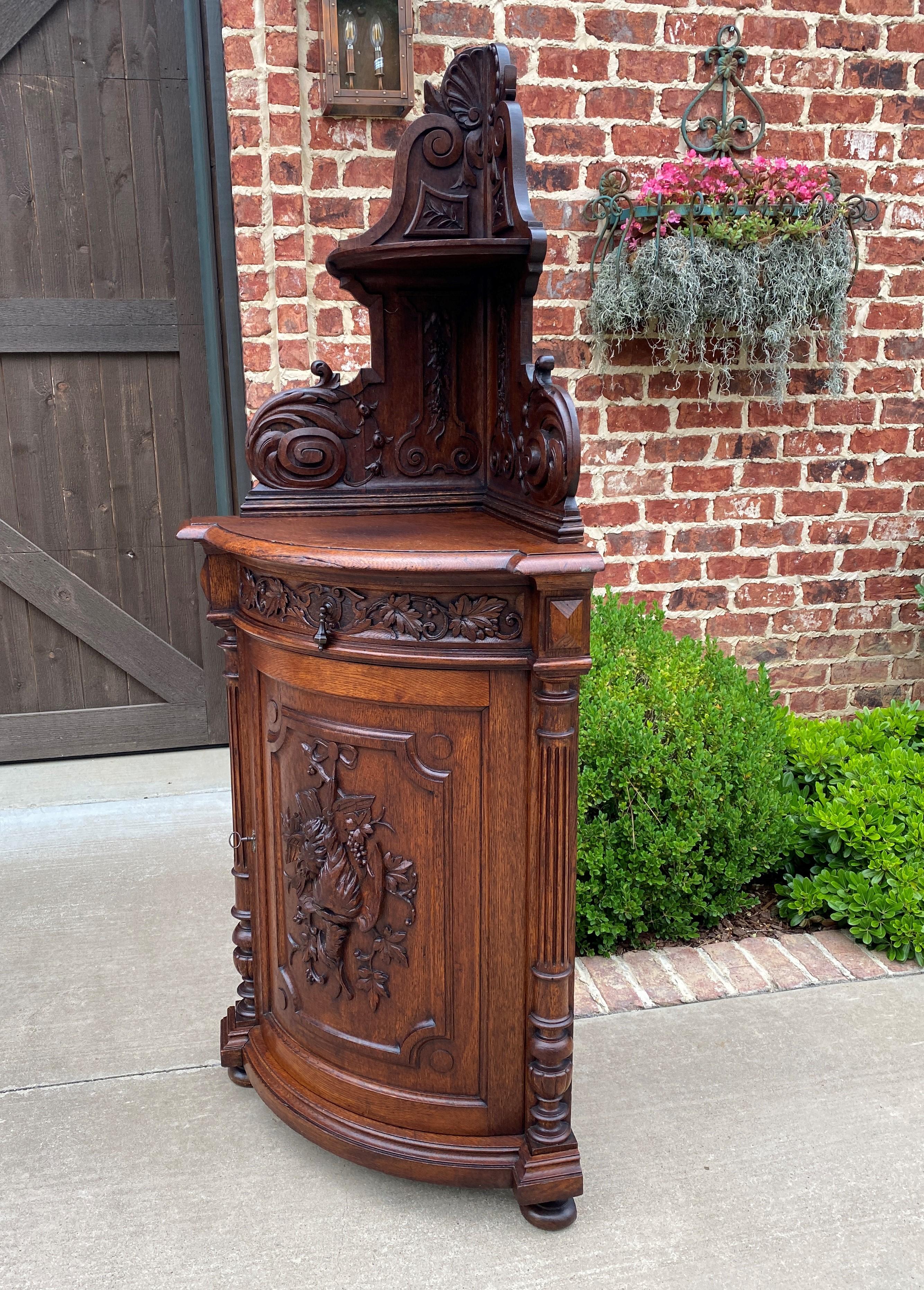Antique French Corner Cabinet Black Forest Cabinet Cupboard Carved Oak Drawer In Good Condition In Tyler, TX