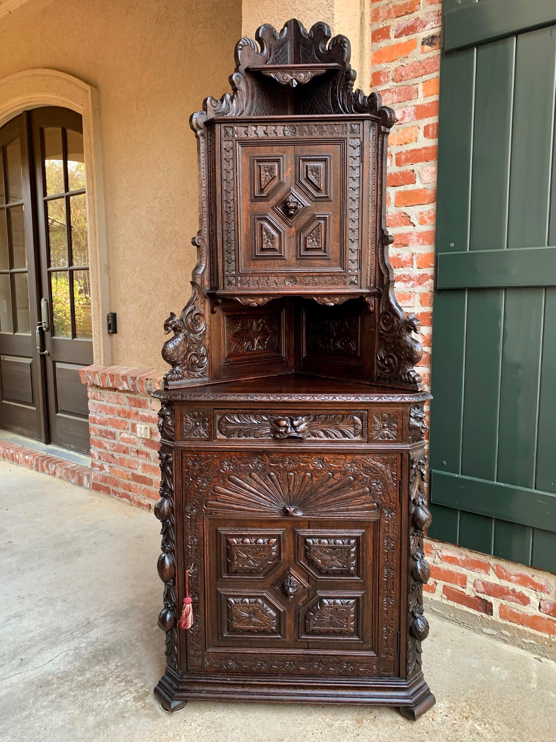 Antique French corner cabinet bookcase carved oak black forest renaissance

~Direct from France~
~Majestic antique French corner cabinet with gorgeous, ornate upper cabinet~
~Upper cabinet features carved scalloped sides with two level upper