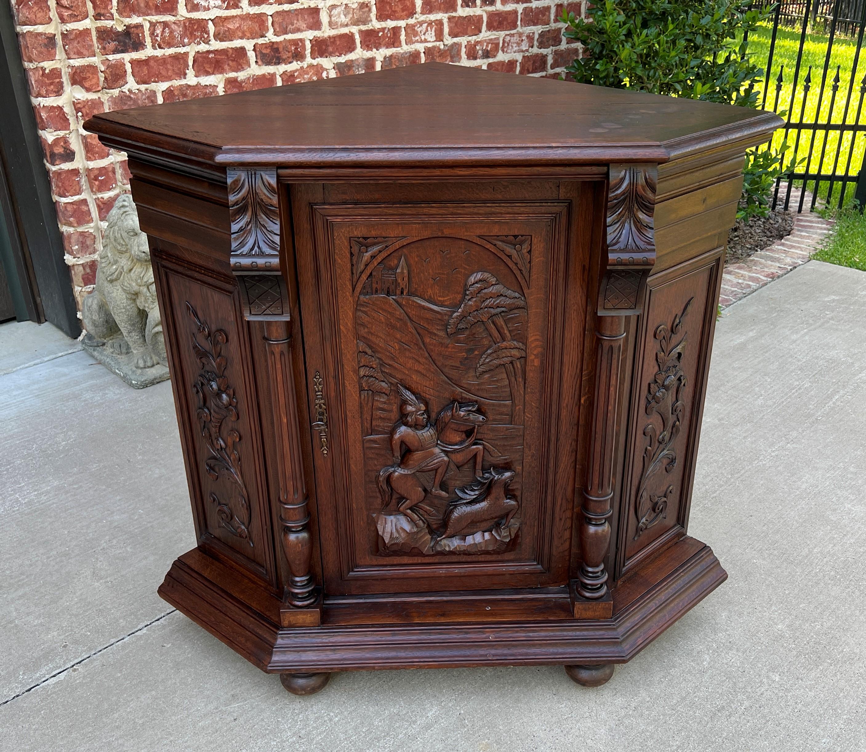 BEAUTIFULLY CARVED Antique French Oak CORNER Cabinet, Bookcase, Display or Storage Cabinet ~~c. 1880s

Full of classic French style~~charming horse and rider hunting scene with deer on lower door~~fluted columns with canted corners~~plank