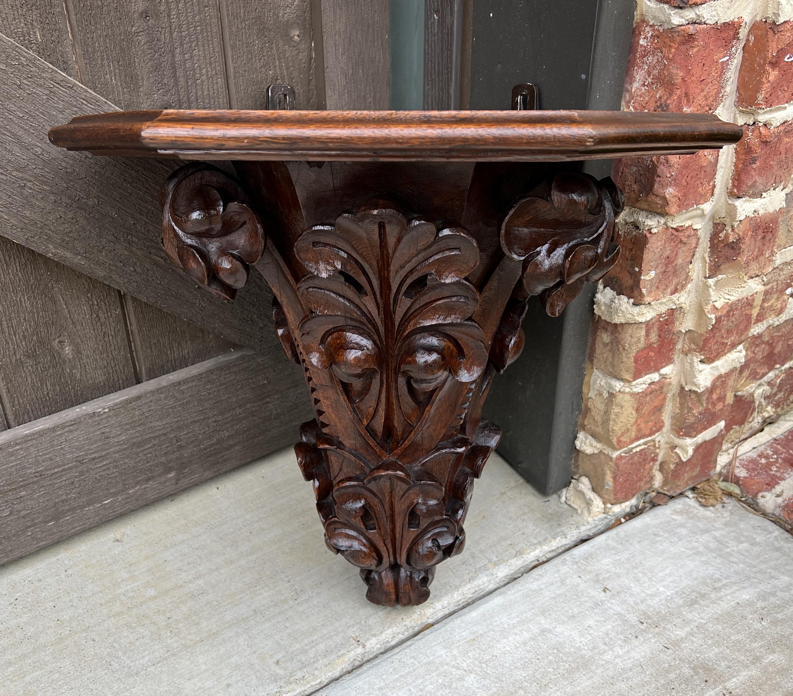 EXQUISTE Antique French Oak Corner Corbel Hanging Wall Shelf or display Pedestal~~circa 1880s

Fabulous French flourish accents with canted corners and beveled edge top~~beautiful oak patina~~cast iron brackets for hanging

 The perfect