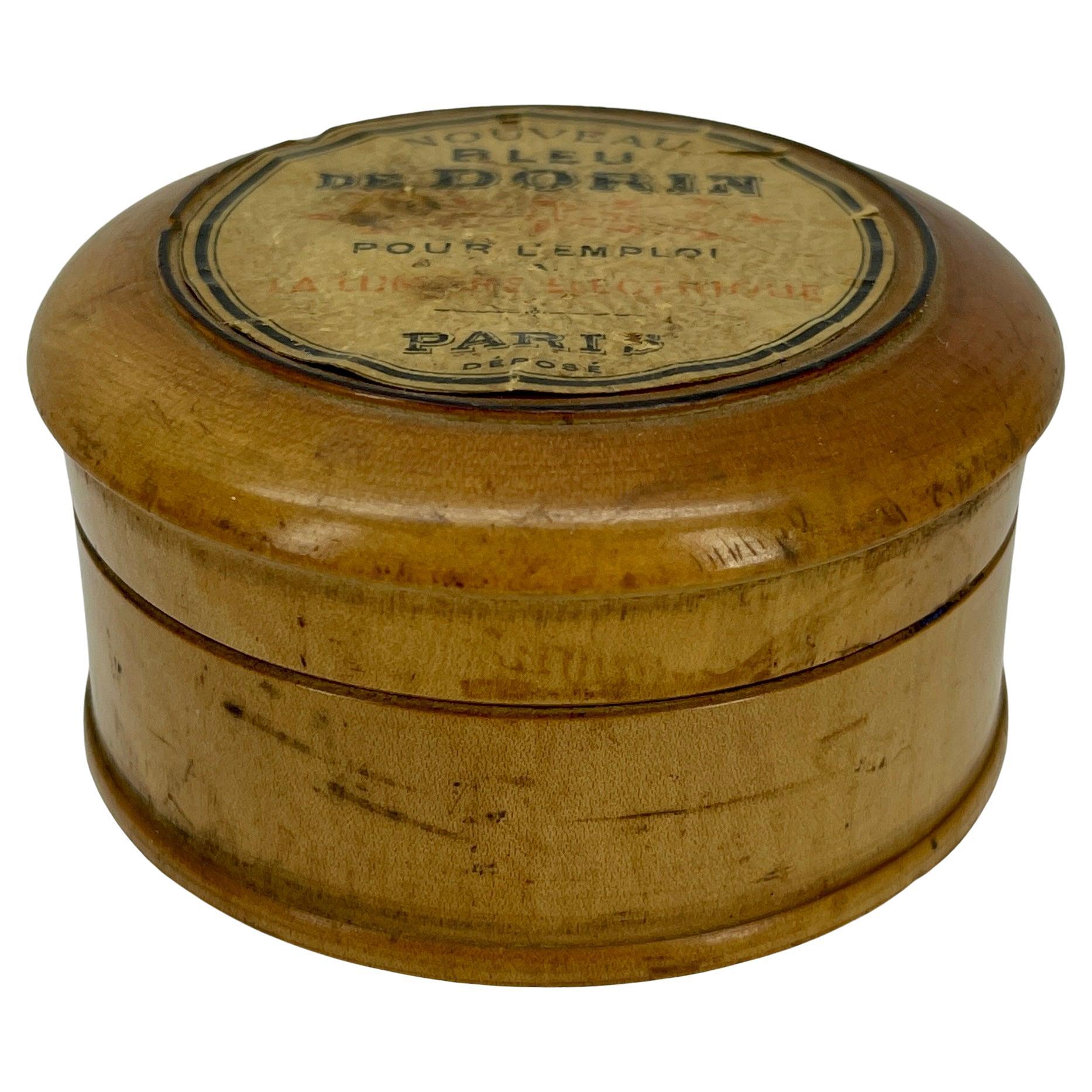 Art Deco woman's cosmetic face powder box. This petite wooden box has it's original label on top reading Blue De Dorin; a well known French toiletry company. The vanity box is sweet and simply elegant sitting on display in a boudoir or bathroom. Add