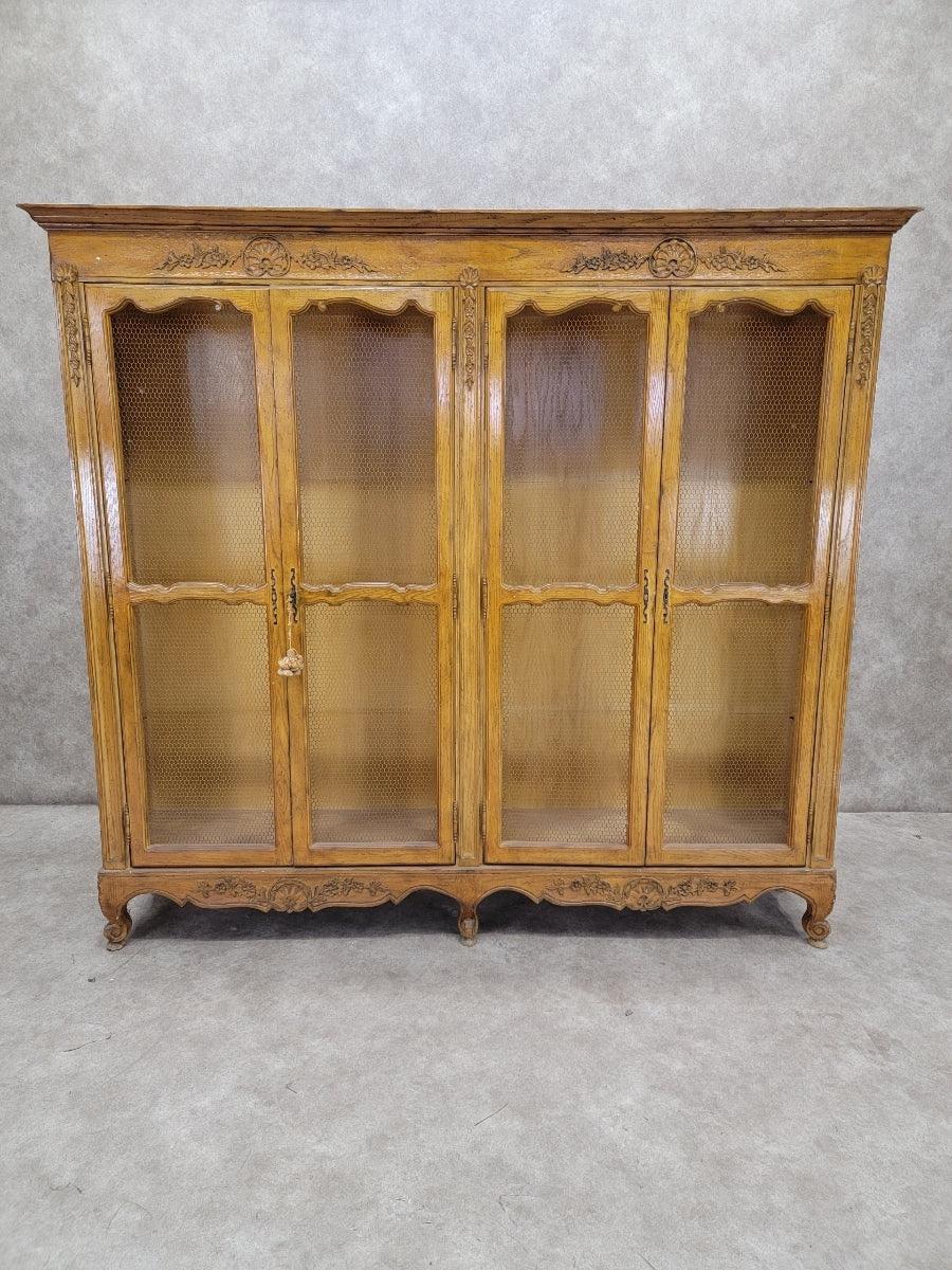 Antique 18th Century Style French Country 4 Door Chicken Wire Paneled Bookcase

Store and display your treasured items in this large bookcase. The bookcase is trimmed with intricate floral carvings. 

