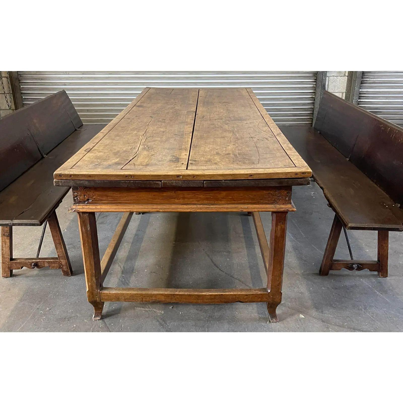 Antique 18th century French Country farmhouse extension table & bench seating. It features two hidden leaves that pullout on each long side as well as two metamorphic benches that have chair backs that fold up.

Additional information: