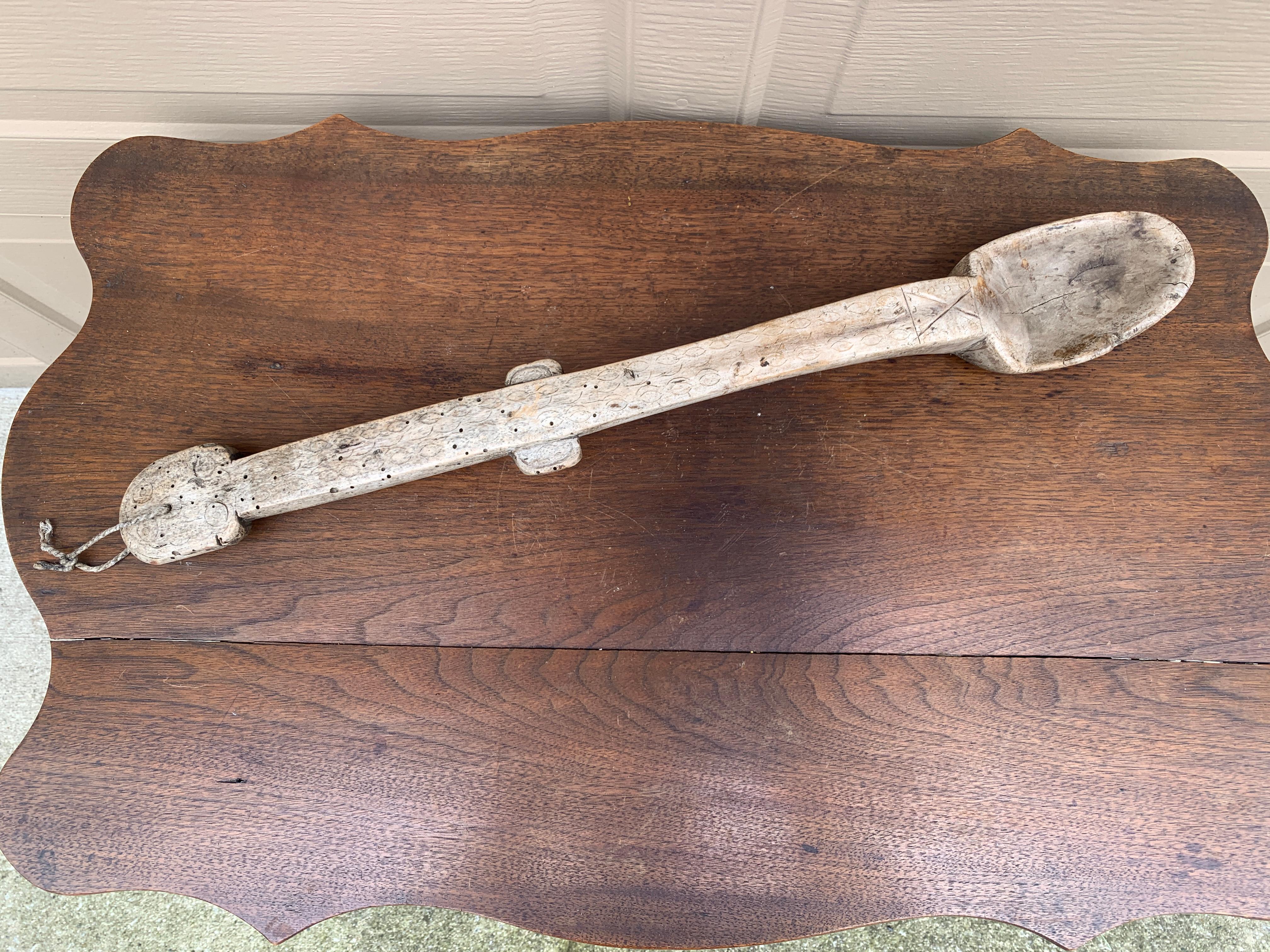 A beautiful antique French country wooden spoon hand-carved from one piece of wood that would add character and charm to any space. This piece could be used as wall decor or is ready to use in the kitchen.

France, Late 19th Century

Measures: 3