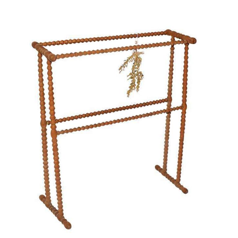 Antique French Country bleached pinewood stick and ball drying rack. Sourced from France, this piece was created in the 1800s. Made of bleached pine wood, this drying rack was made to dry fresh herbs. Herbs were picked from the garden, tied up, and