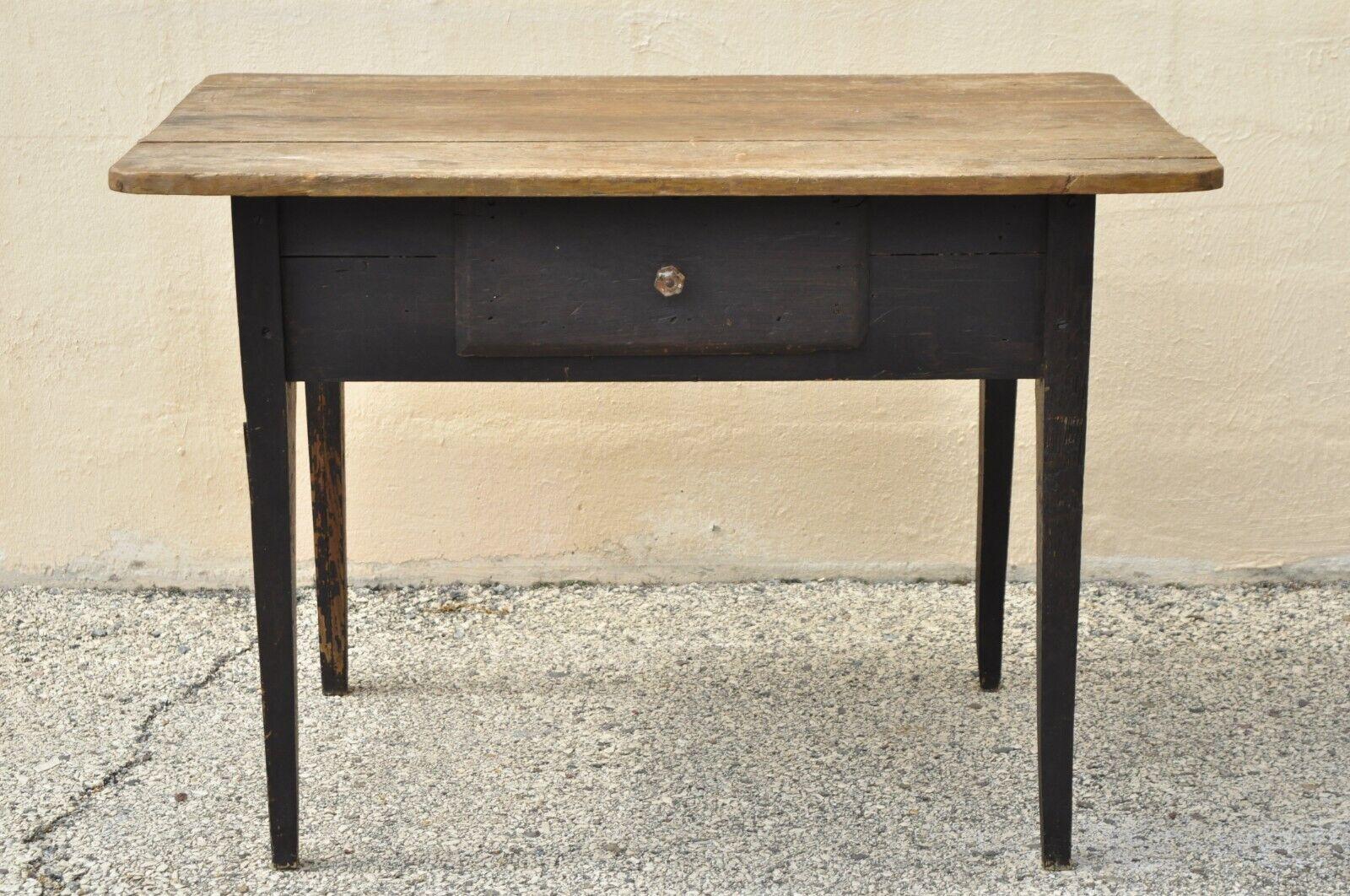 Antique French Country Rustic Black Distress Painted 1 Drawer Breakfast Table. Item features a wooden plank top, black distress painted base, glass drawer pull, 1 drawer, tapered legs, very nice antique item. Circa 19th Century. Measurements: 29.5
