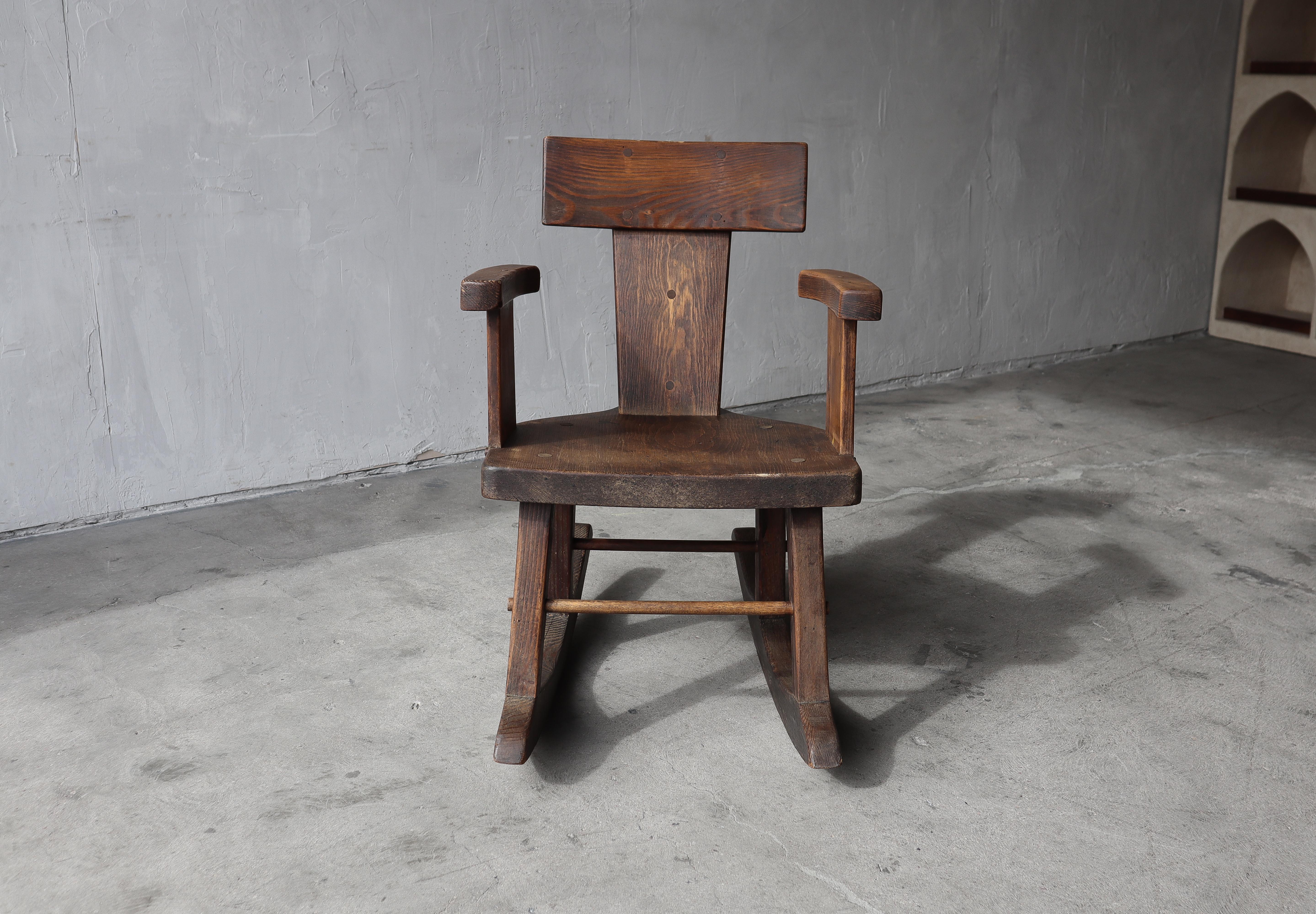 Absolutely adore the handmade details of this Antique French Craftsman Wabi Sabi Rocking Chair.  No glue, no nails, just dowels.  Such a cool, artistic piece.

Solid pine, finished in a dark espresso color that has worn with age and use gaining more