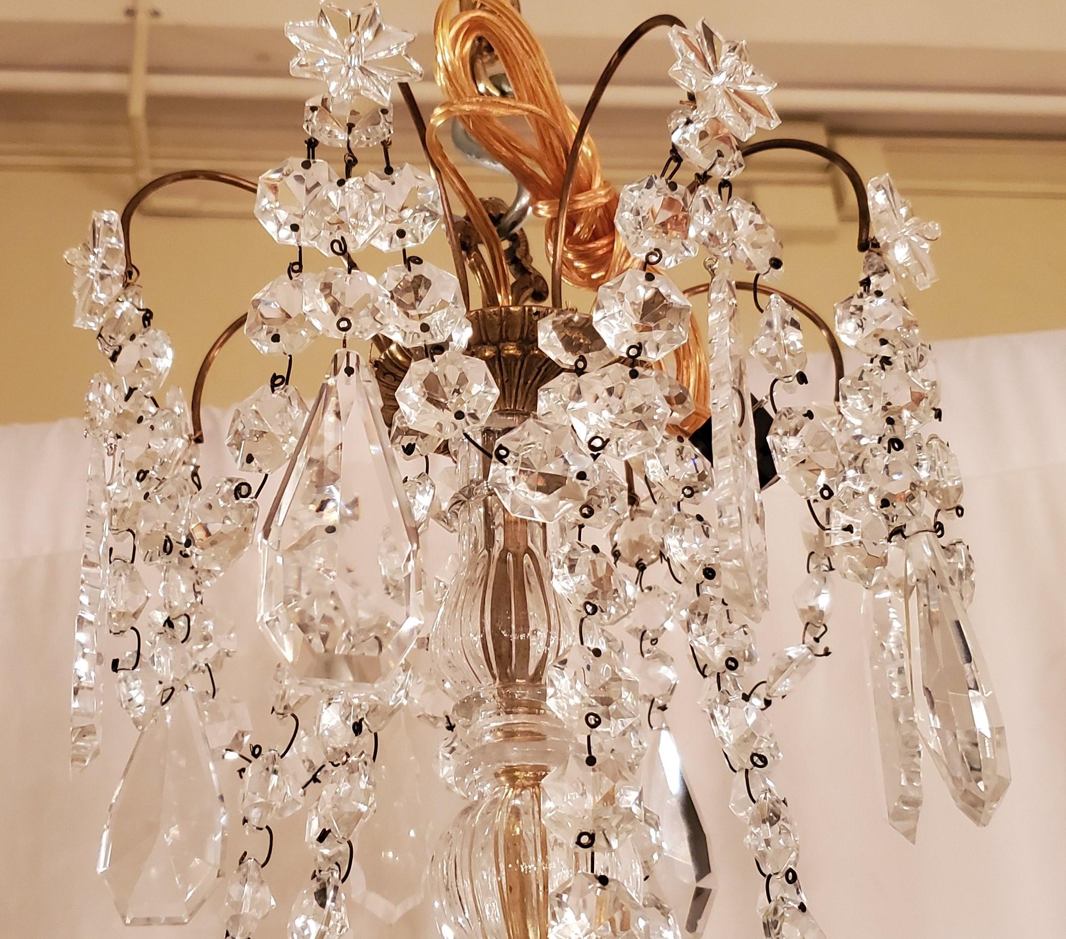 This chandelier has its orginial crystals.