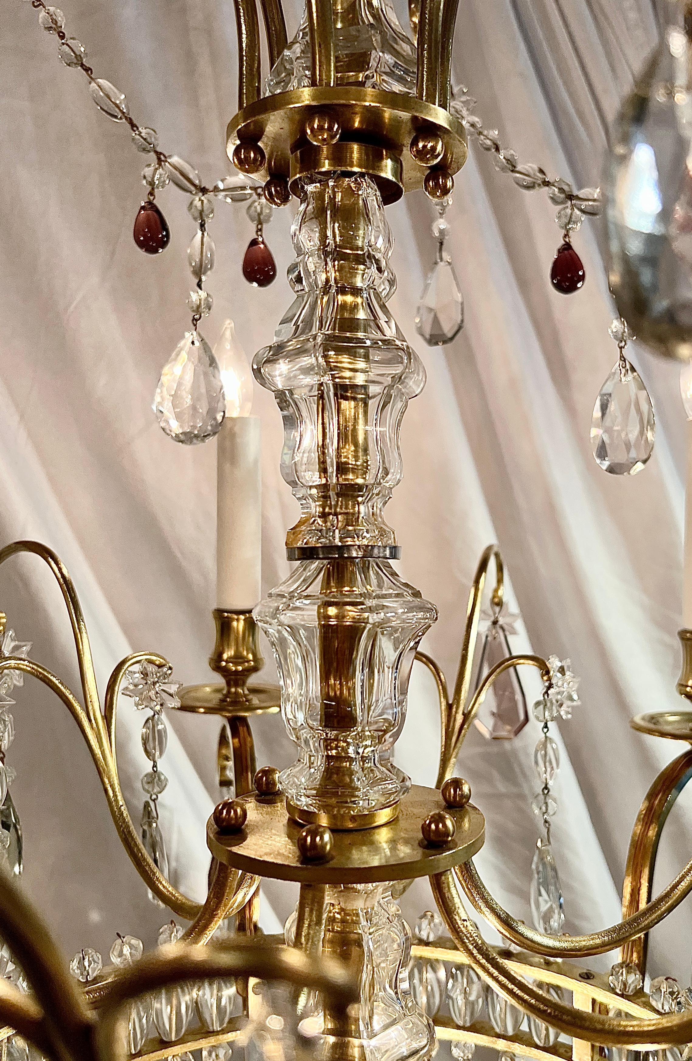 Antique French Clear & Colored Cut Crystal and Gold Bronze Chandelier, Circa 1890.
Elegant chandelier in an unusual and pretty shape with heavily draped crystals. 