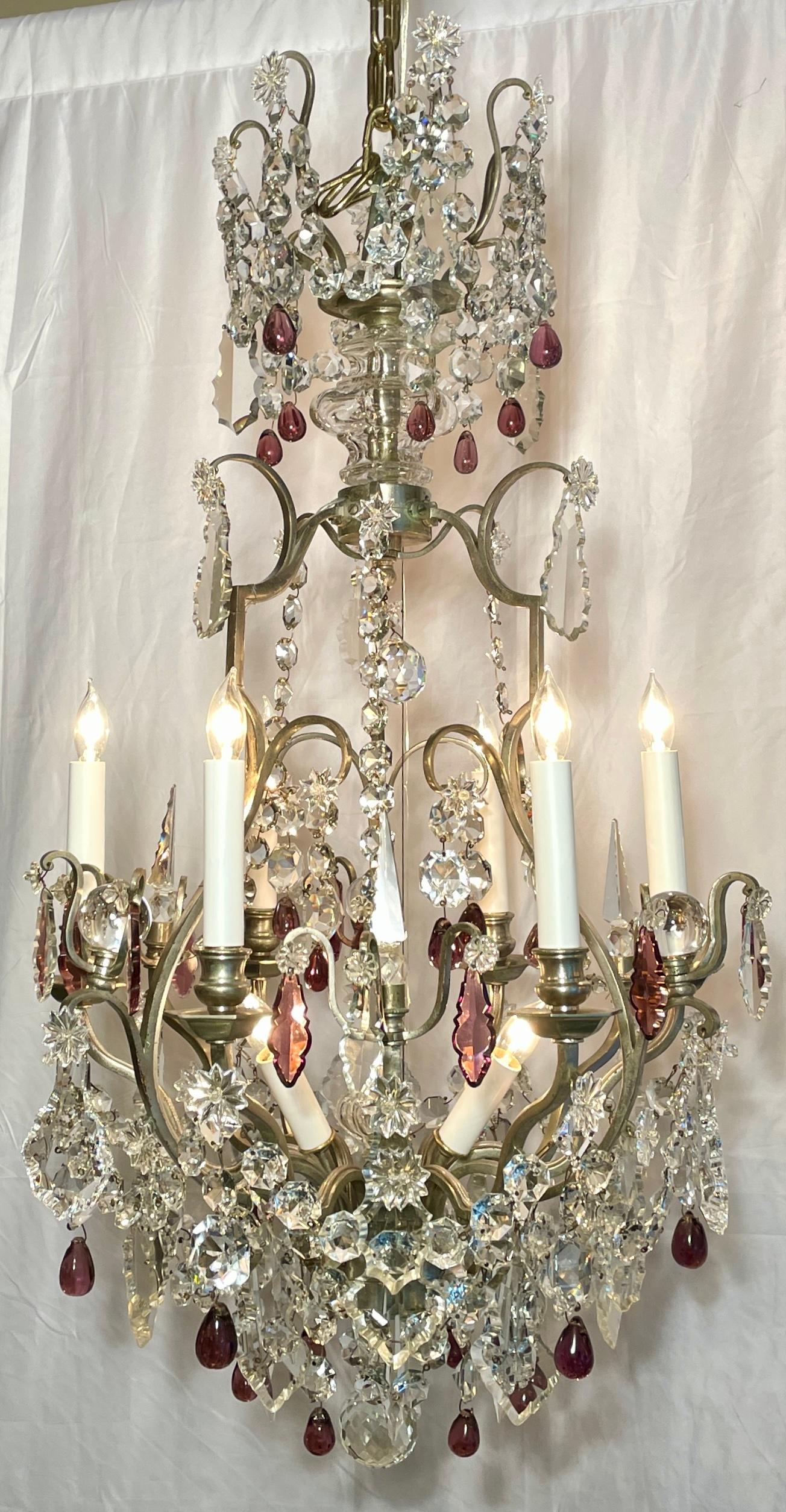 Antique French fine crystal and silver on bronze 9-light chandelier, circa 1890-1910. Cut crystal prisms in clear and purple hues.