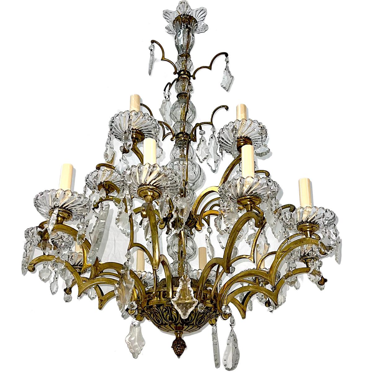 A circa 1900 French bronze chandelier with 15 lights and with crystal pendants.

Measurements:
Diameter: 29