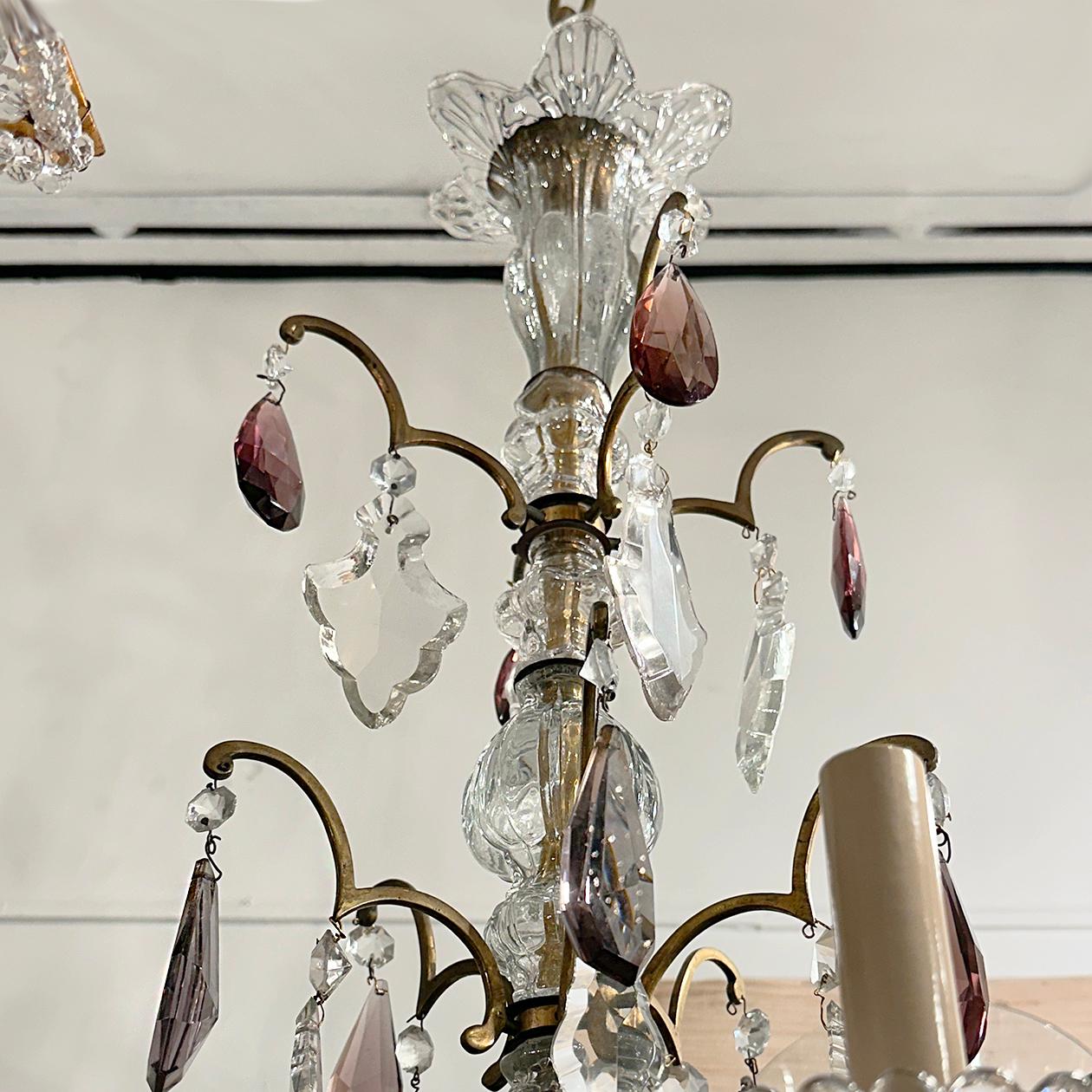 A circa 1900's French bronze and crystal chandelier with 10 lights.

Measurements:
Height: (minimum drop) 42