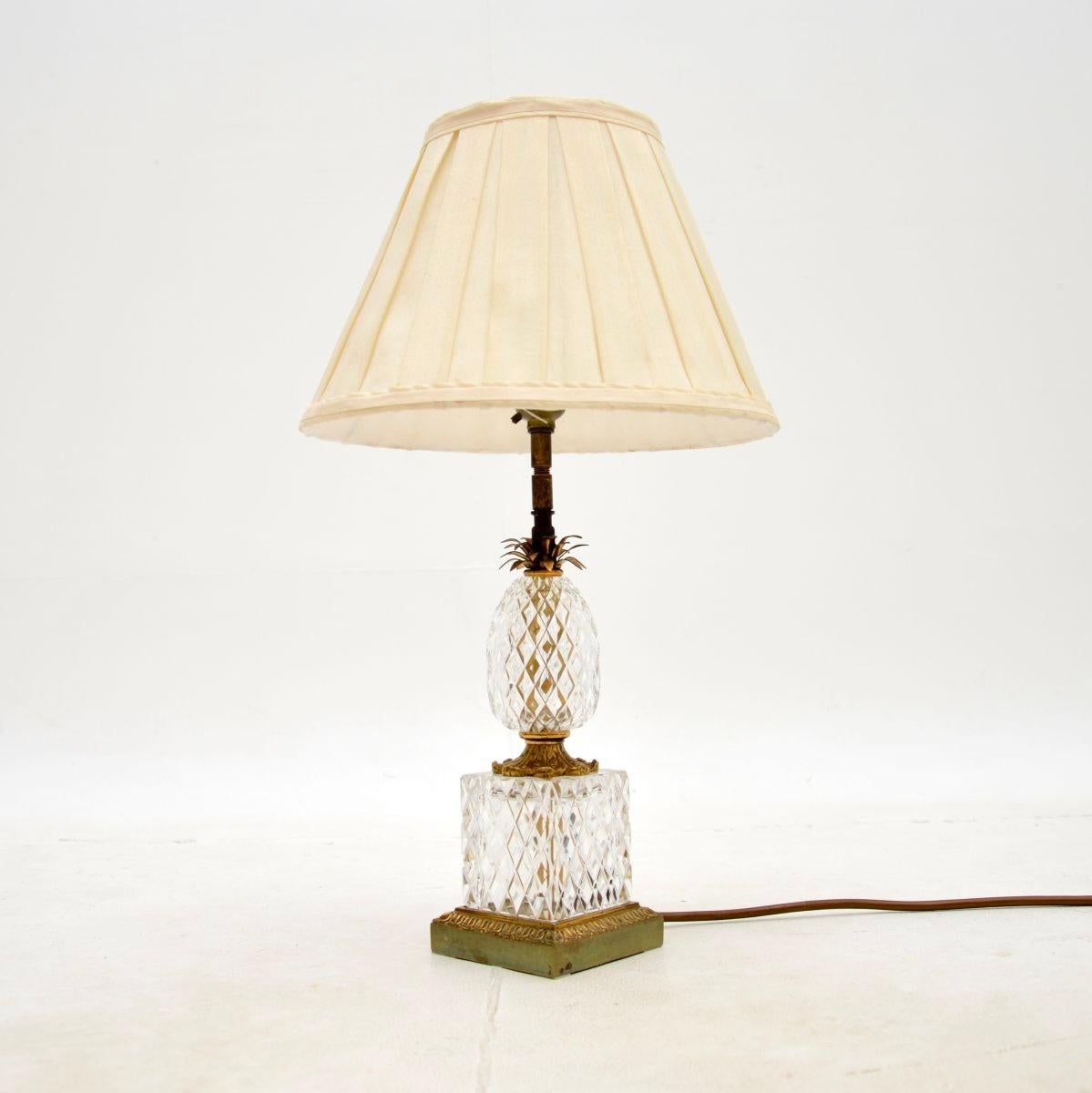 A stunning antique French crystal glass and brass table lamp. This was made in Paris and dates from around the 1950’s.

It is of superb quality, the label beneath the lamp says ‘Crystal Bronze Paris’, so though the metal looks like brass to us, it