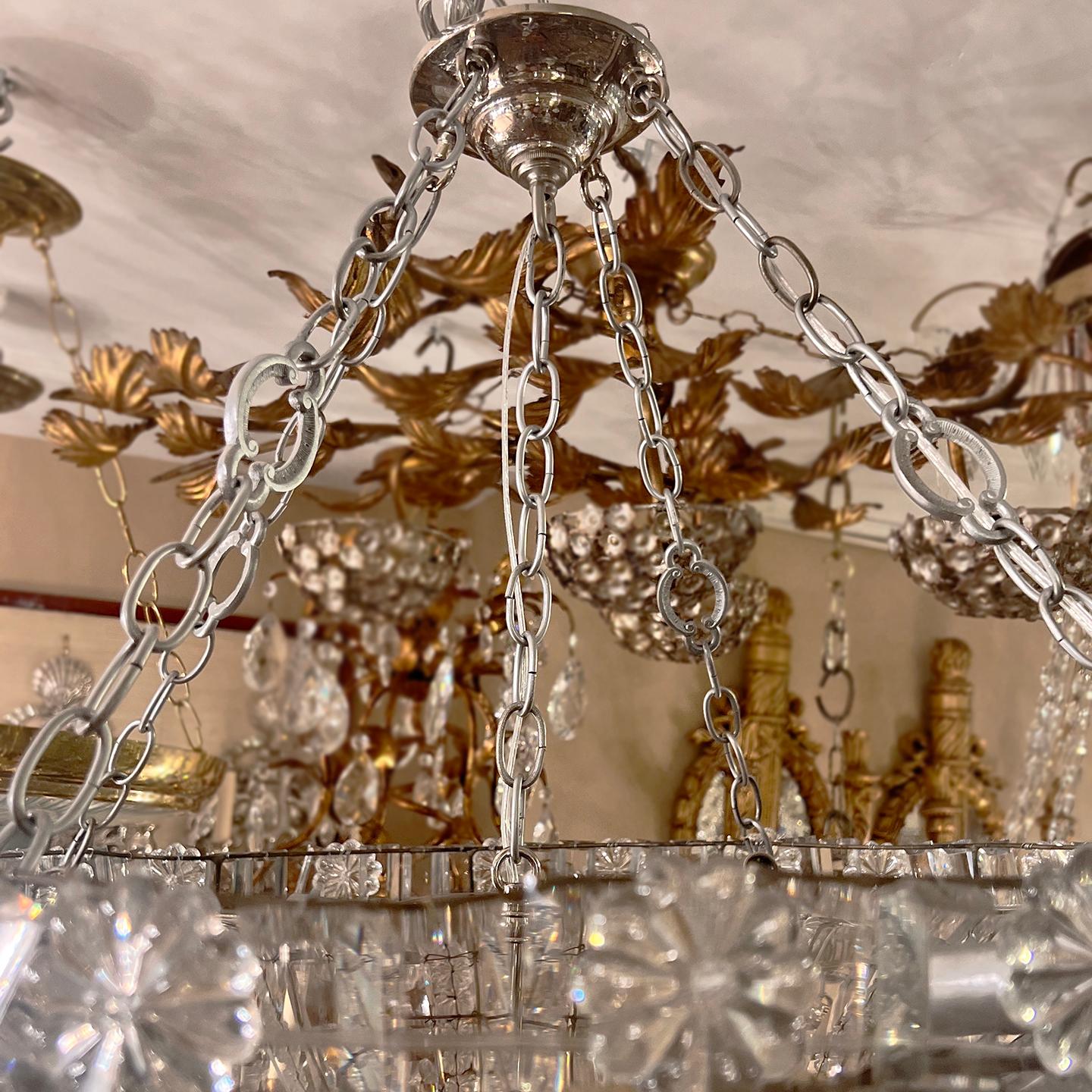 A circa 1900's French woven crystals light fixture with 12 candelabra interior lights.

Measurements:
Present drop: 30