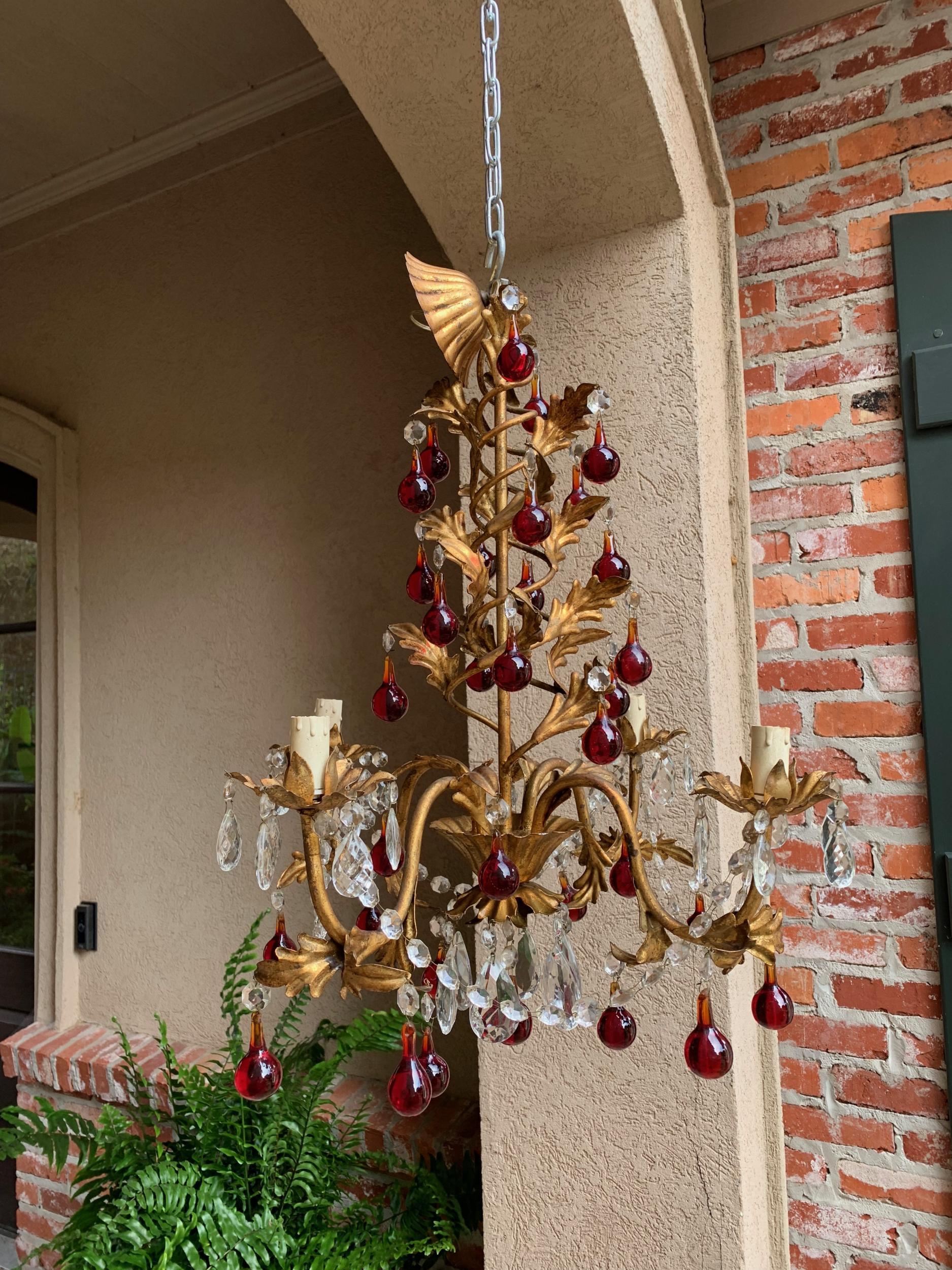 Antique French crystal prism chandelier Murano glass red drop gold gilt 4 arm

~Direct from France~
~Beautiful antique chandelier having a gilded spiral upper frame with gold gilt leaves that continue throughout, on the sweeping arms and forming