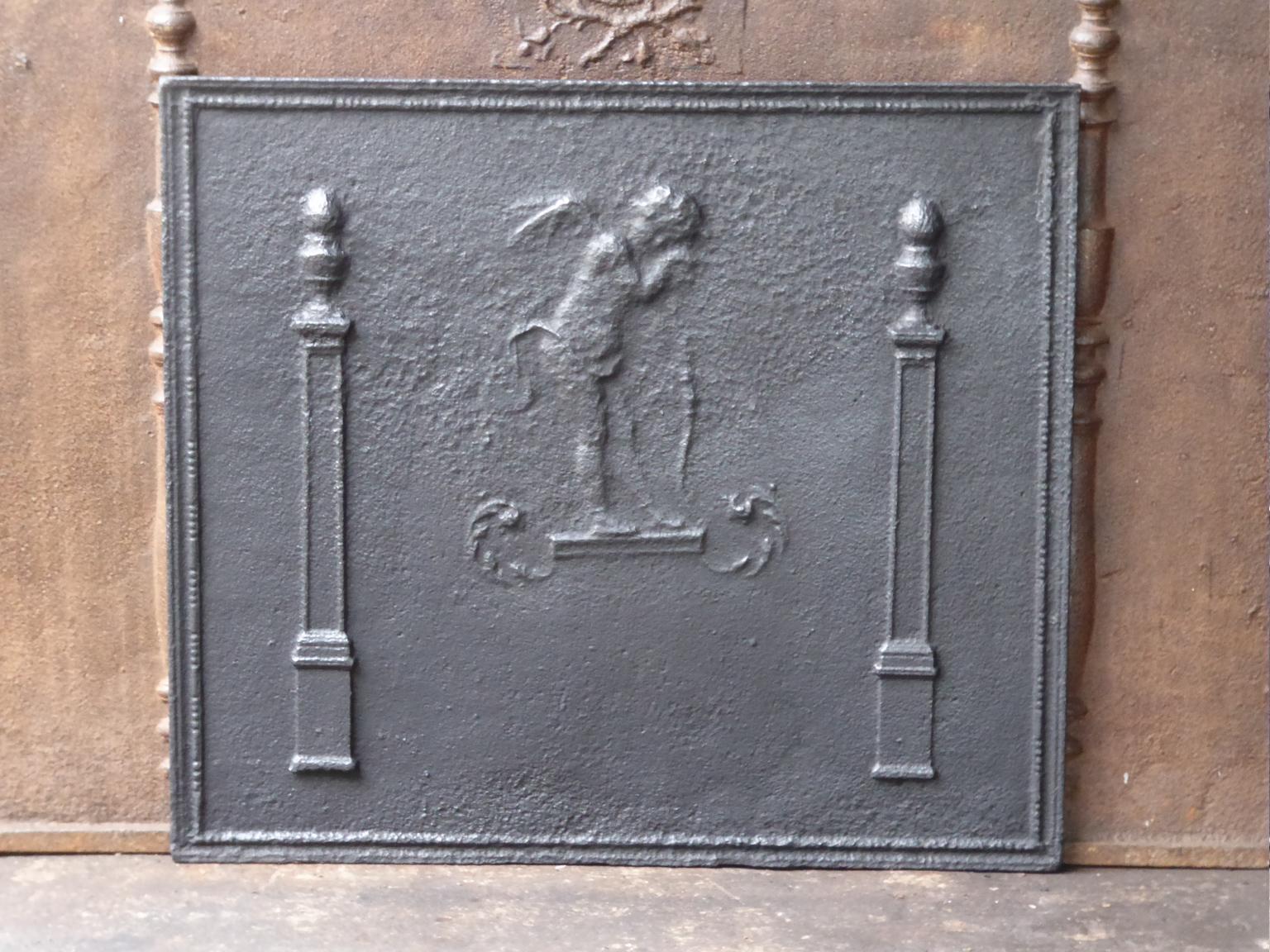 18th-19th century French neoclassical fireback. The cupid is flanked by two pillars of freedom, which represent one of the three values of the French Revolution.

The fireback is made of cast iron and has a black patina. The fireback is in a good