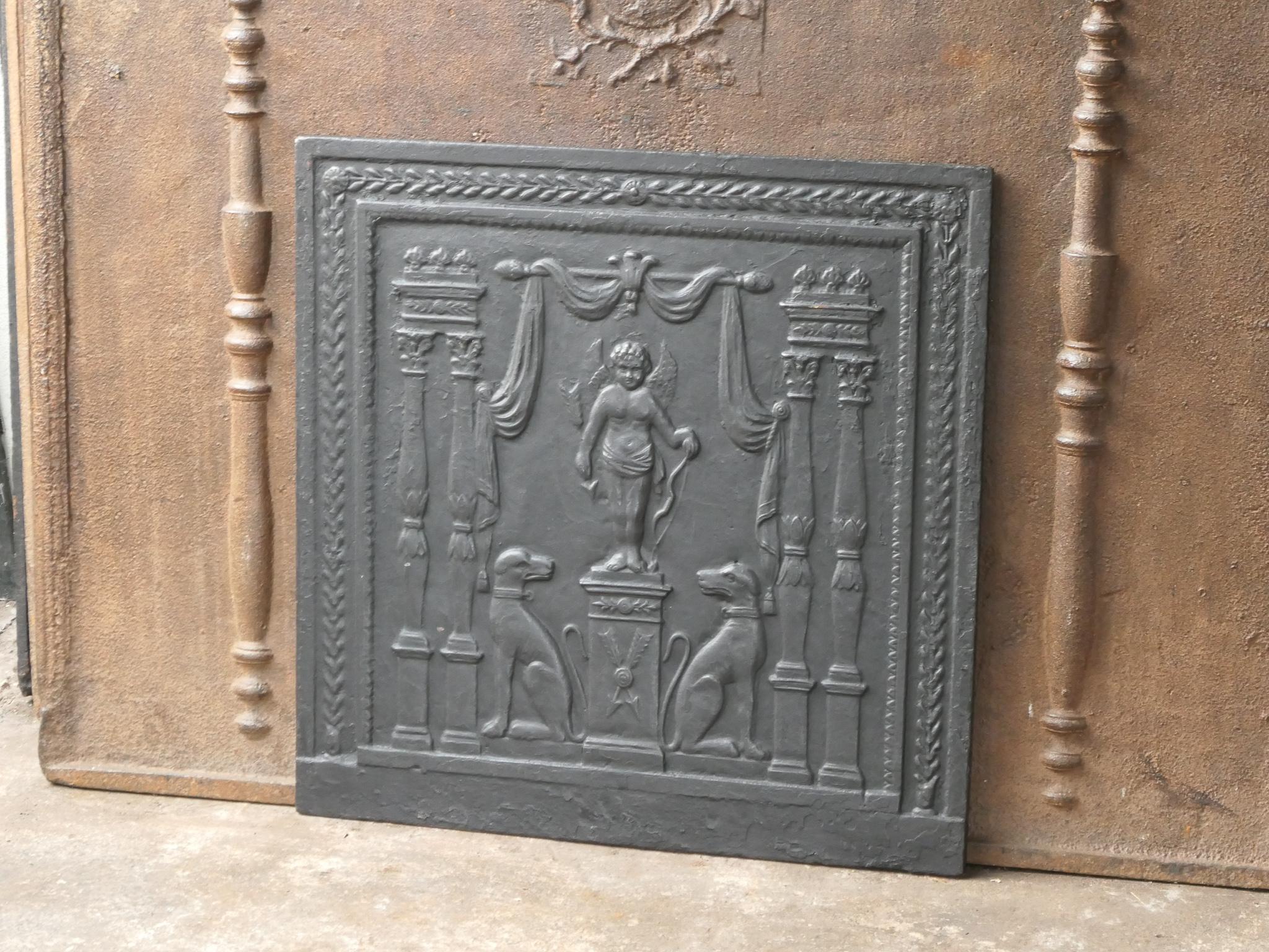 18th-19th Century French neoclassical period fireback with a cupid.

The fireback is made of cast iron and has a black / pewter patina.
The condition is good, no cracks.






