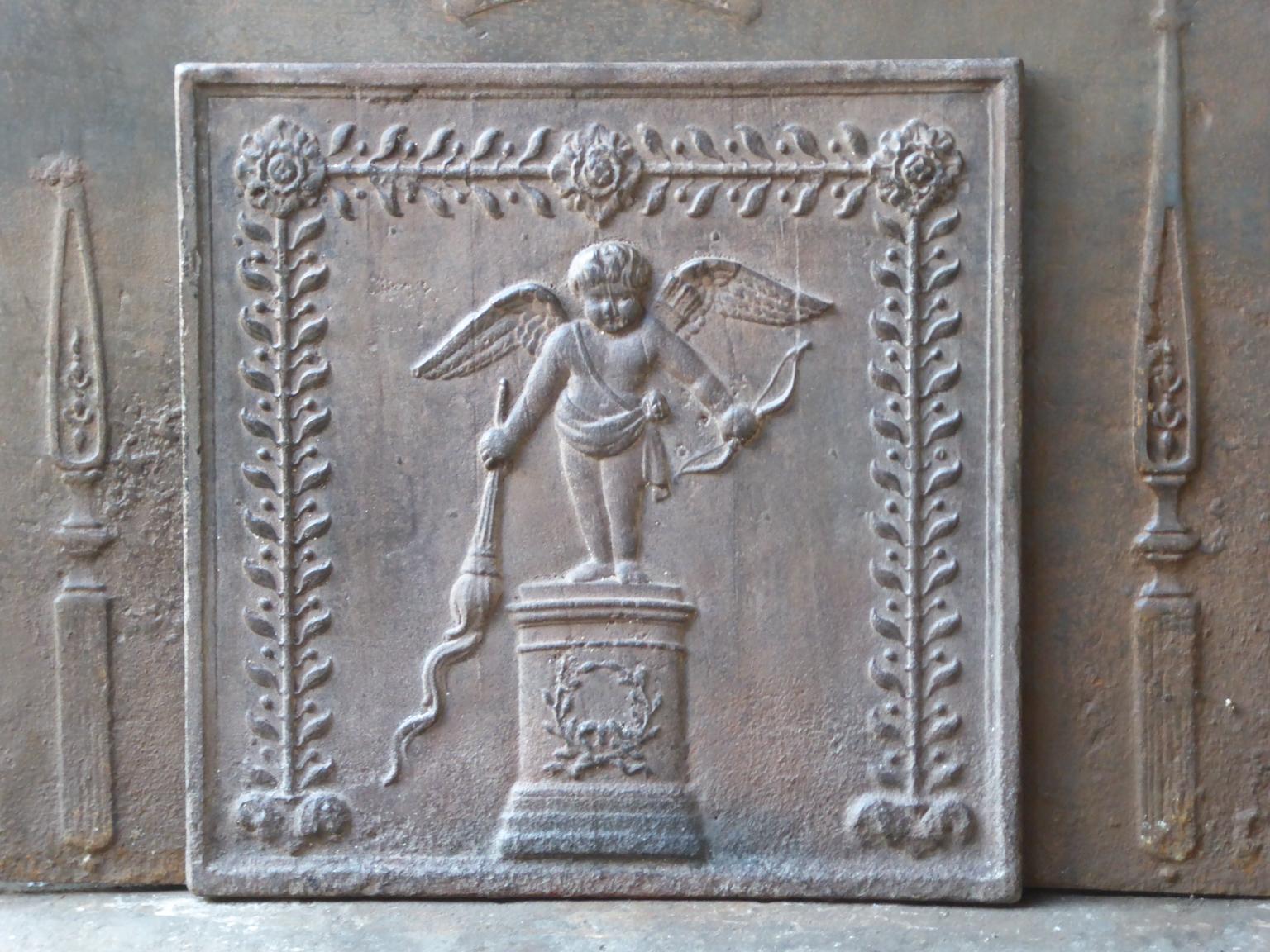 Late 18th of early 19th century French Neoclassical fireback with a cupid on a pedestal. The fireback is made of cast iron and has a natural brown patina. Upon request it can be made black or pewter. The condition is good, no cracks.















 