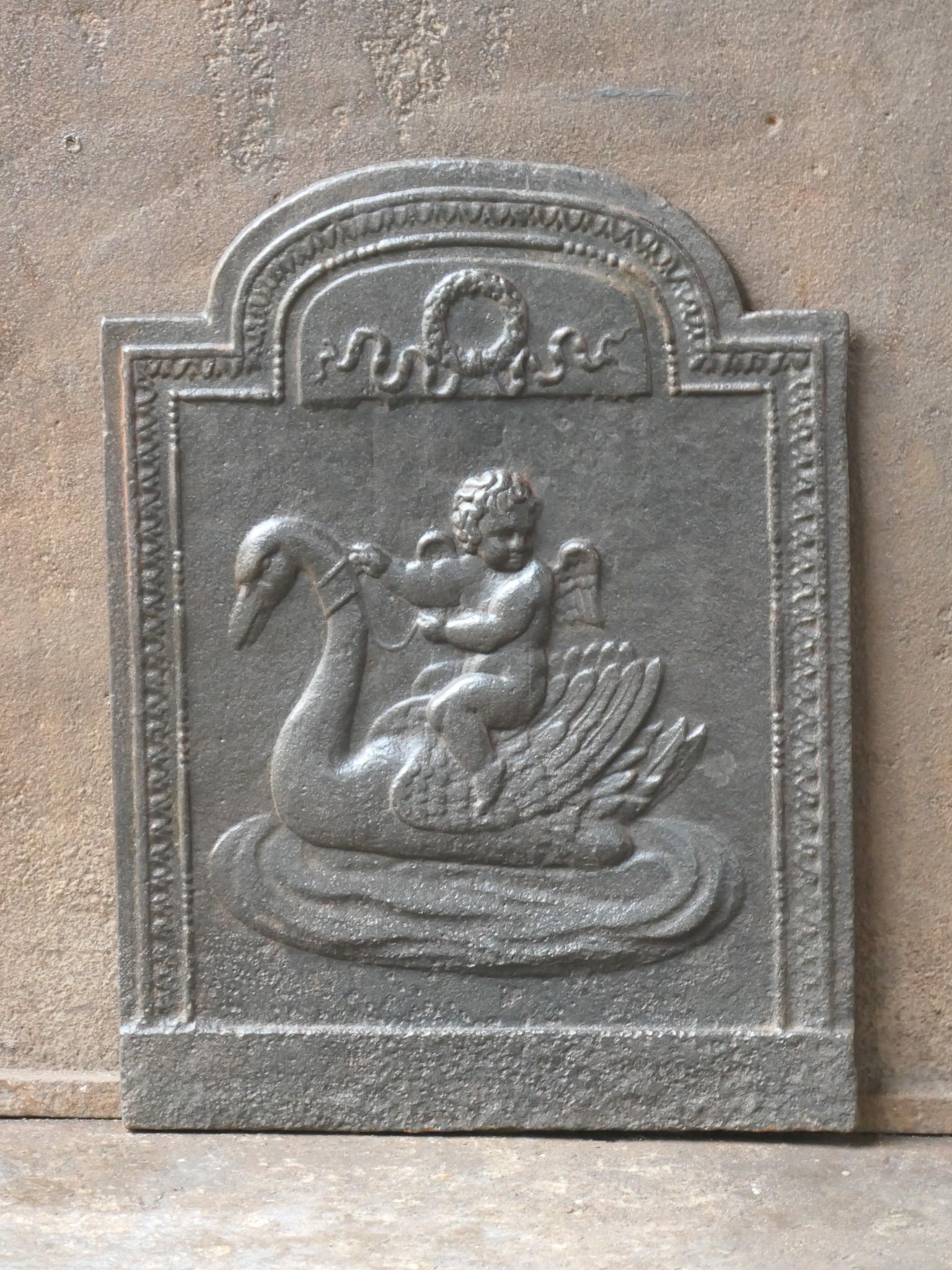 18th - 19th century French neoclassical period fireback with a cupid.

The fireback is made of cast iron and has a natural brown patina. Upon request it can be made black / pewter at no extra cost. It is in a good condition and does not have cracks.