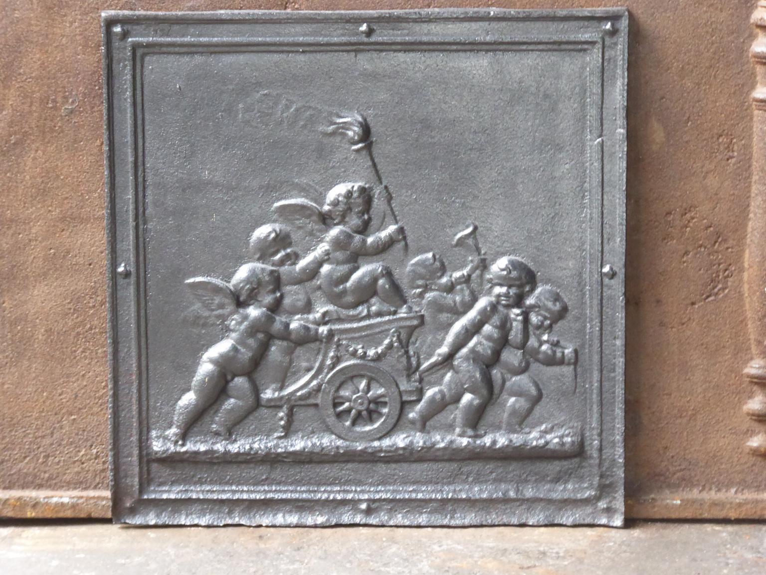 19th century French Napoleon III fireback with cupids. The fireback is made of cast iron and has a black or pewter patina. It is in a good condition and does not have cracks.















   