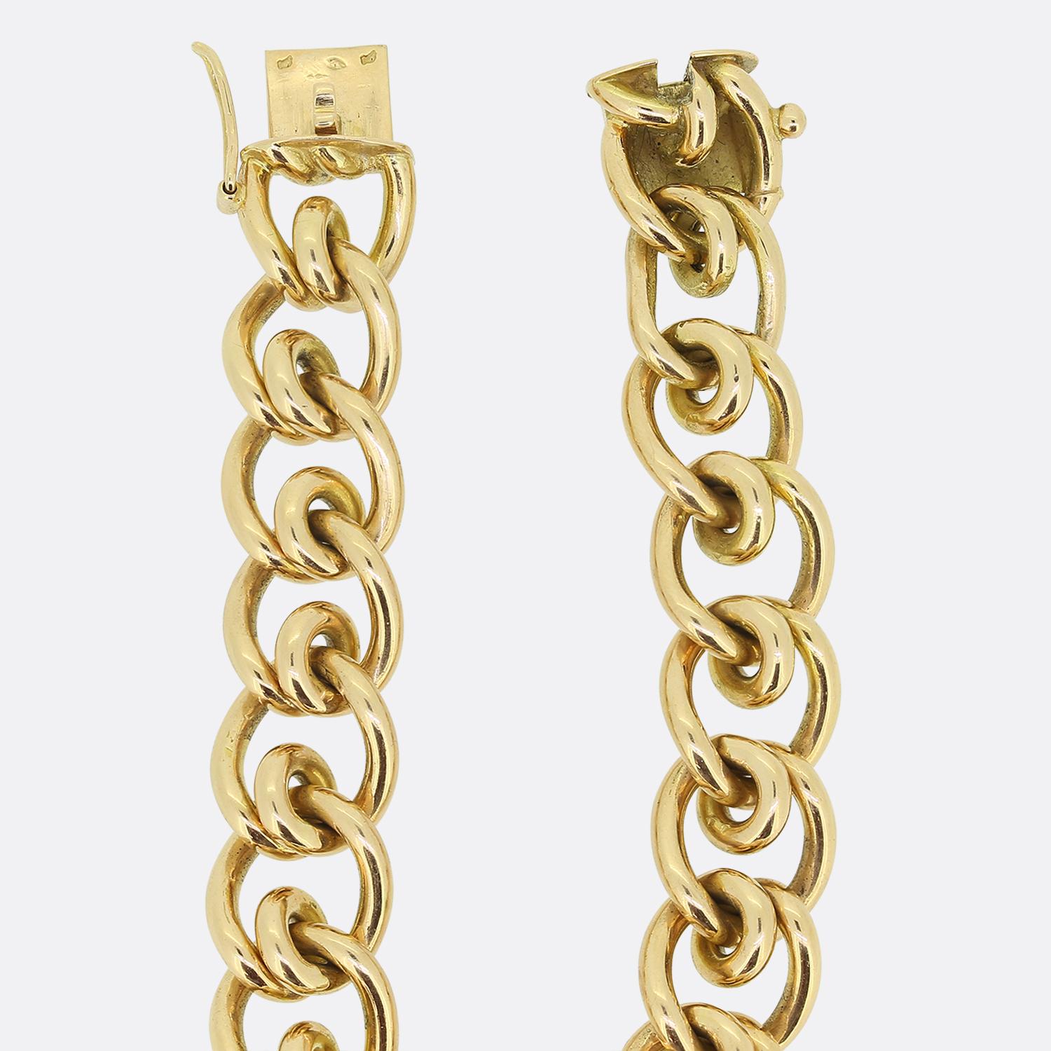 Here we have an exceptional chain link bracelet. This fine French antique piece has been crafted from a warm 18ct yellow gold with solid fancy curb links. The bracelet weighs an impressive 63.0 grams, is 12mm wide in width and is fastened secured by