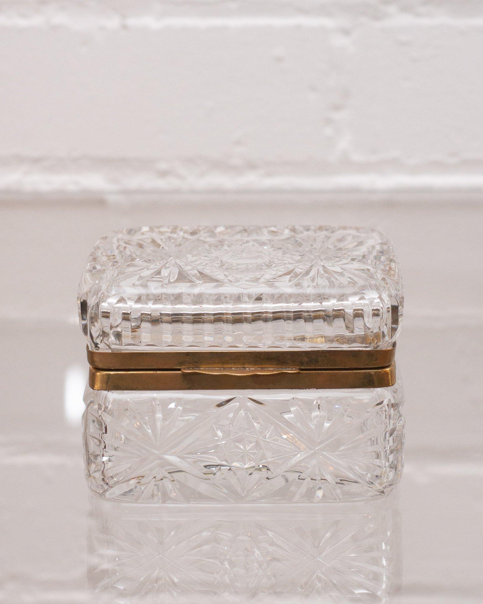 This antique crystal and bronze box makes a statement in any space. An early 1900s French production, this piece transitions from modern to Classic interiors seamlessly with its sophisticated shape and light catching quality.